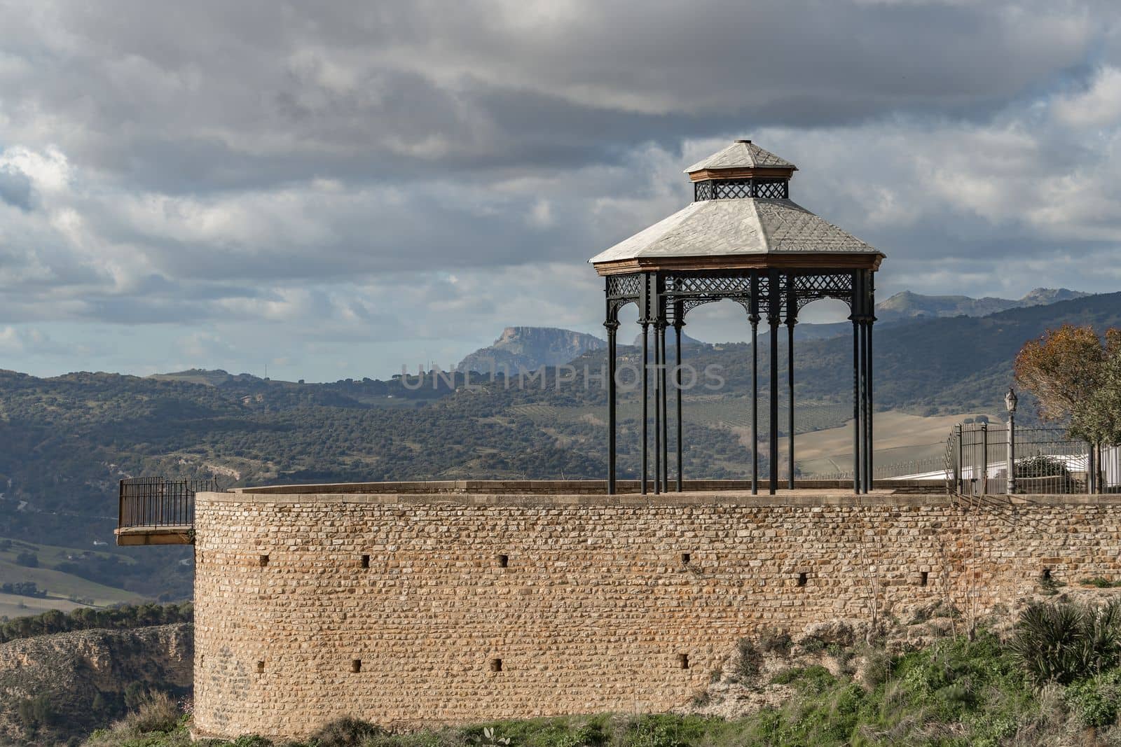 viewpoint over a mountainous landscape with cloudy sky in the city of ronda malaga