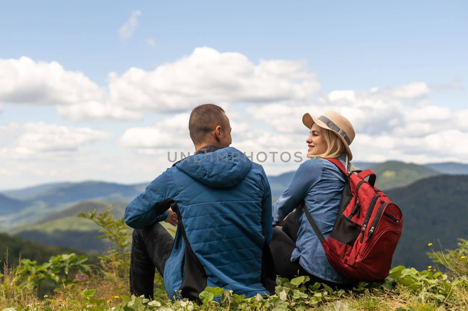 Couple travelers Man and Woman sitting relaxing mountains, view Love and Travel happy emotions Lifestyle concept. Young family traveling active adventure vacations.