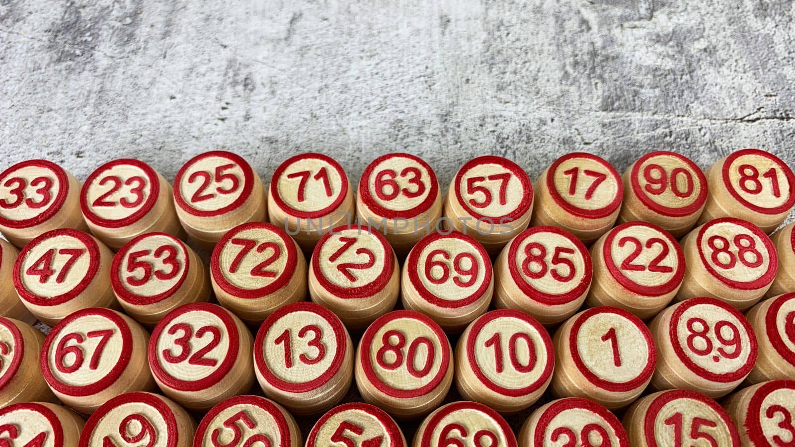 Loto game on the table. Wooden barrels for a board game with family and friends