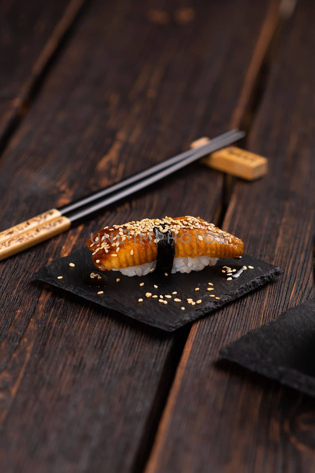 Japanese sushi unagi nigiri sushi eel on wooden background.