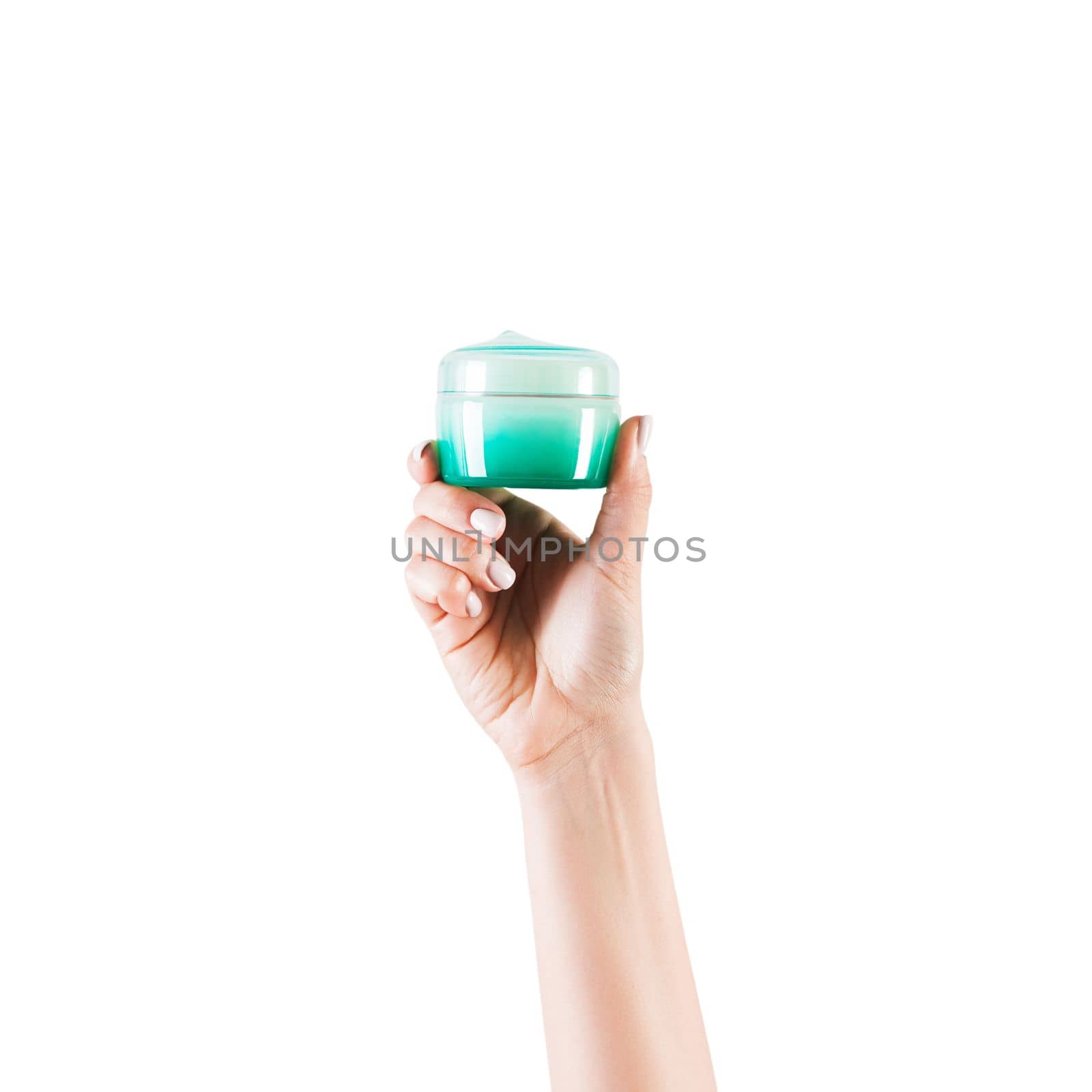 Female hand holding cream bottle of lotion isolated. Girl give jar cosmetic products on white background by Snegok1967