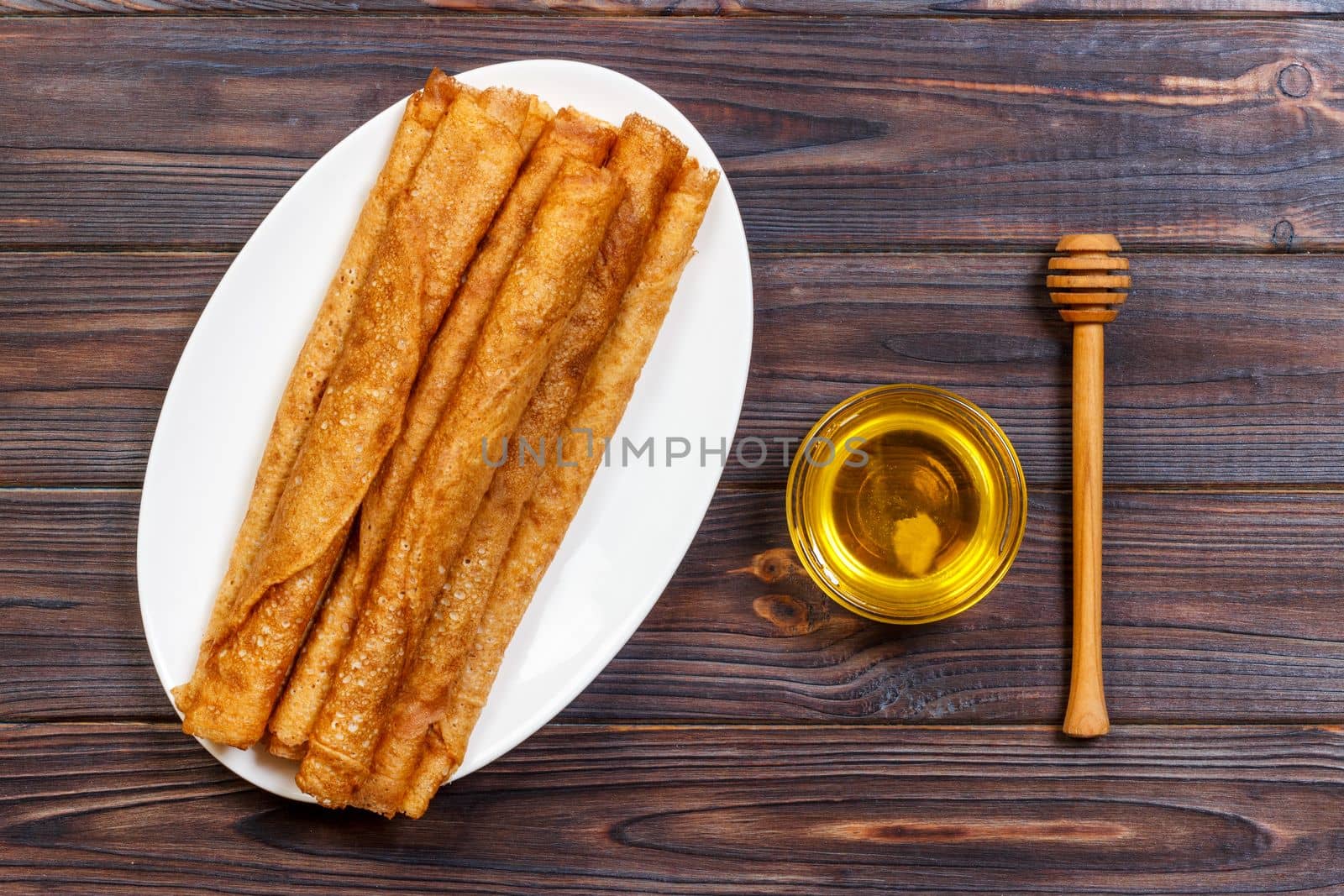 Hot pancakes with sprinkled maple syrup. The good you breakfast. top view.