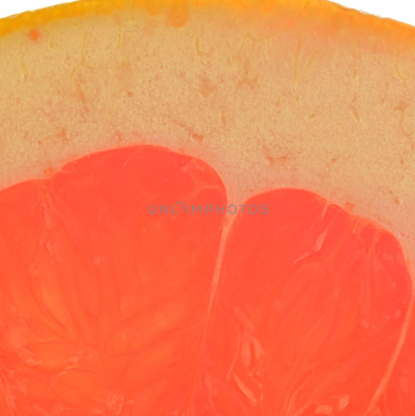 Grapefruit. Fresh organic grapefruit slice on white background. Grapefruit close-up. Slice of blood red ripe grapefruit. Texture of red juicy grapefruit. Macro image by roman_nerud