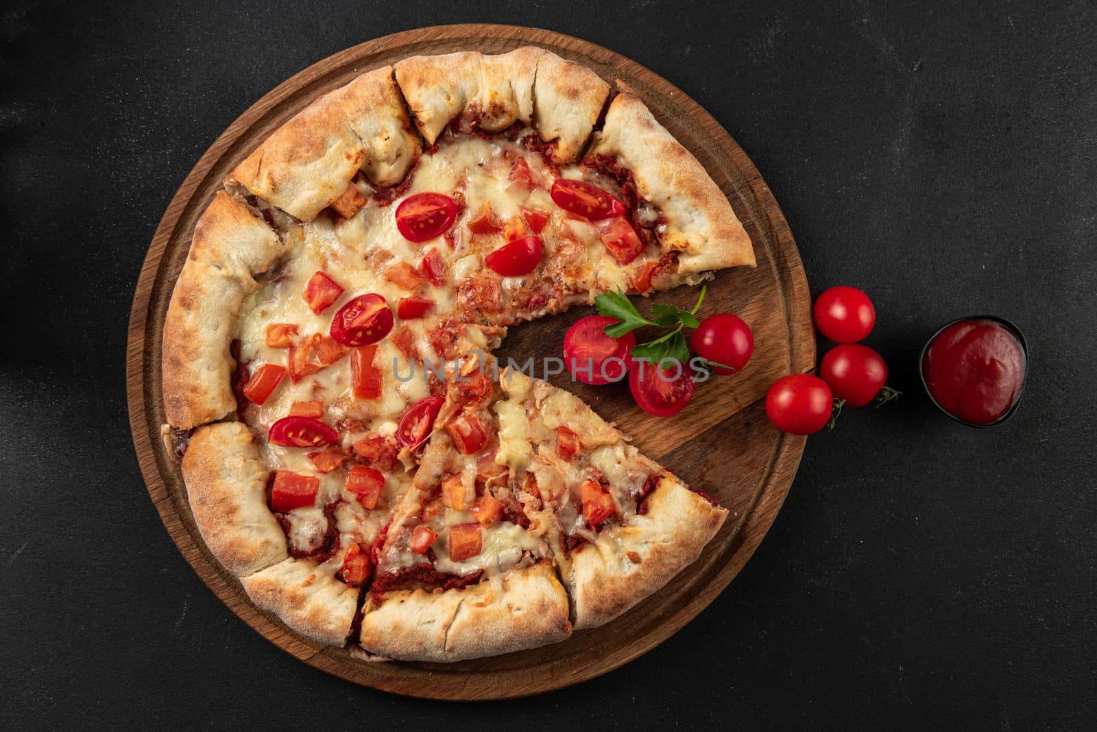 Cooked pizza with ingredients next to make tomato sauce, mozzarella, tomatoes, olive oil, cheese, spices, served on a rustic wooden table. Flat form. Italian margarita pizza. by gulyaevstudio