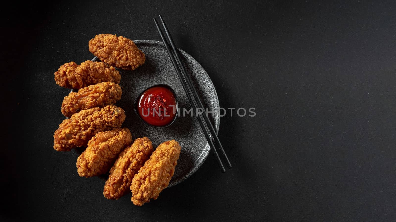 Chicken wings. Traditional asian recipe. Dark background. Top view. Copy space