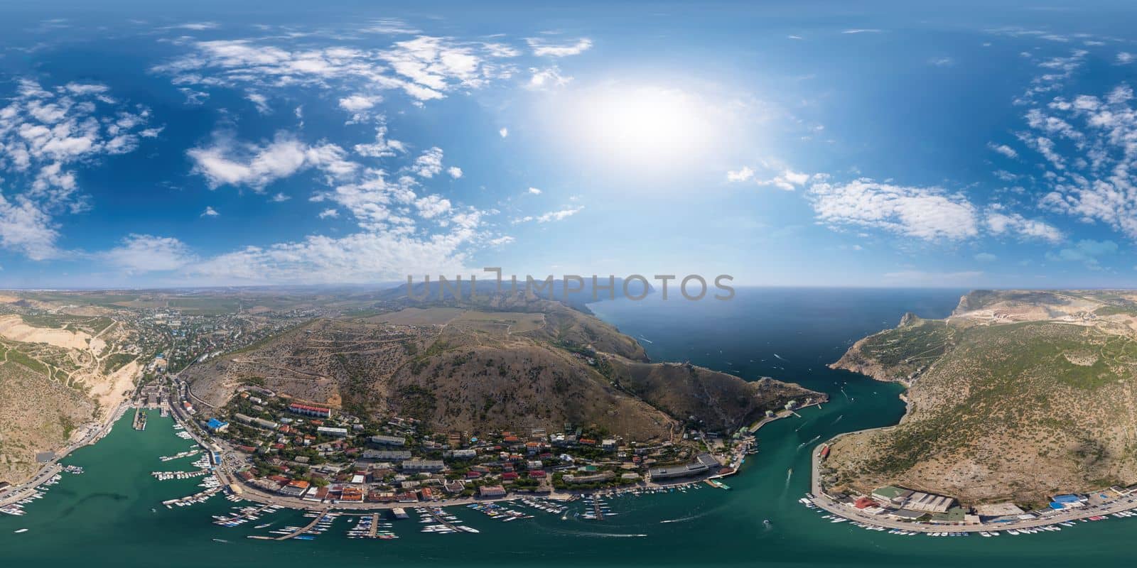 Aerial panoramic view of Balaklava landscape with boats and sea in marina bay. Seamless 360 degree spherical equirectangular panorama. Drone top view shot of port for luxury yachts and sailboats. by panophotograph