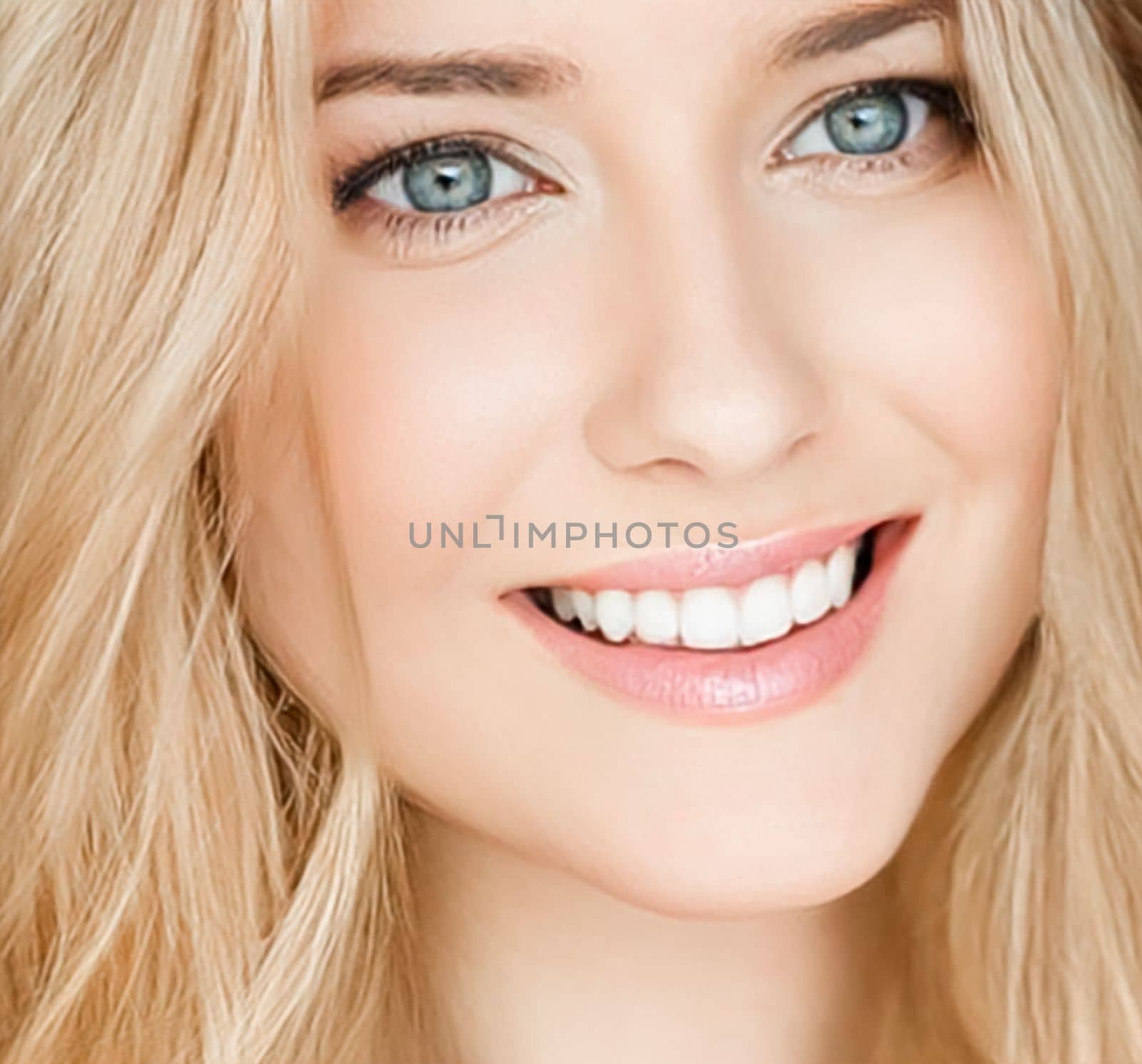Beautiful blonde woman smiling, white teeth smile.