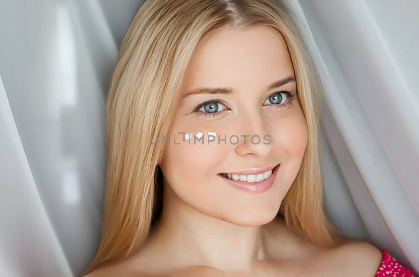 Beautiful woman with skincare cream on her face by Anneleven