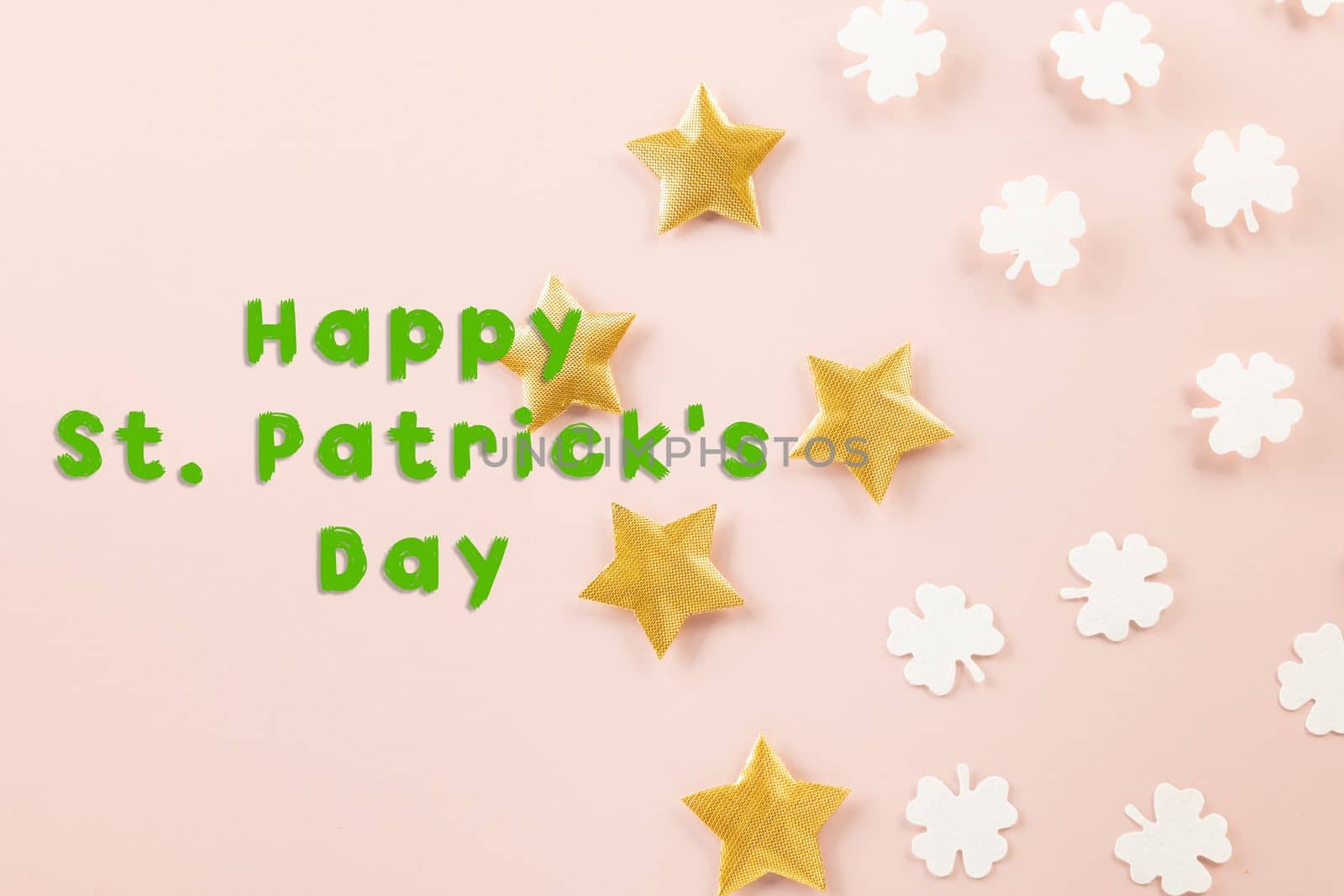 Happy St Patricks Day decoration background. above top view of paper clover leaves festive decor, shamrocks leaves holiday symbol with copy space on colour background, Banner greeting card concept