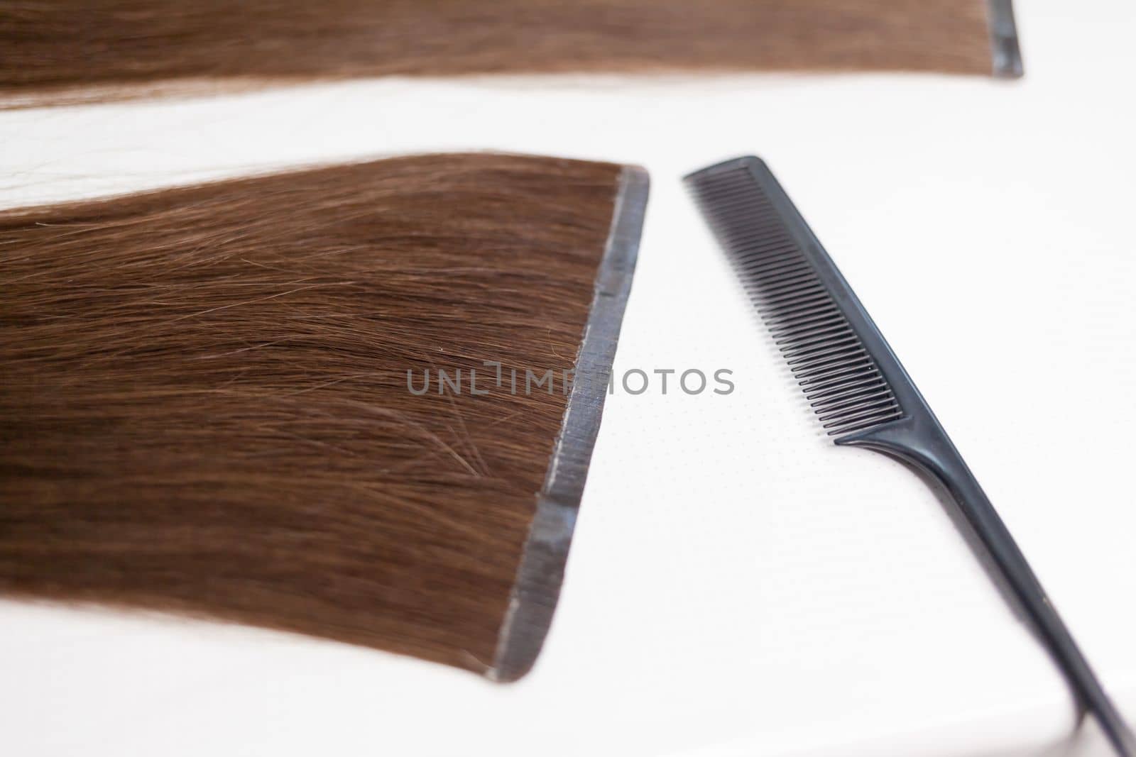 The process of preparing a hair ribbon for extension at home. by AnatoliiFoto