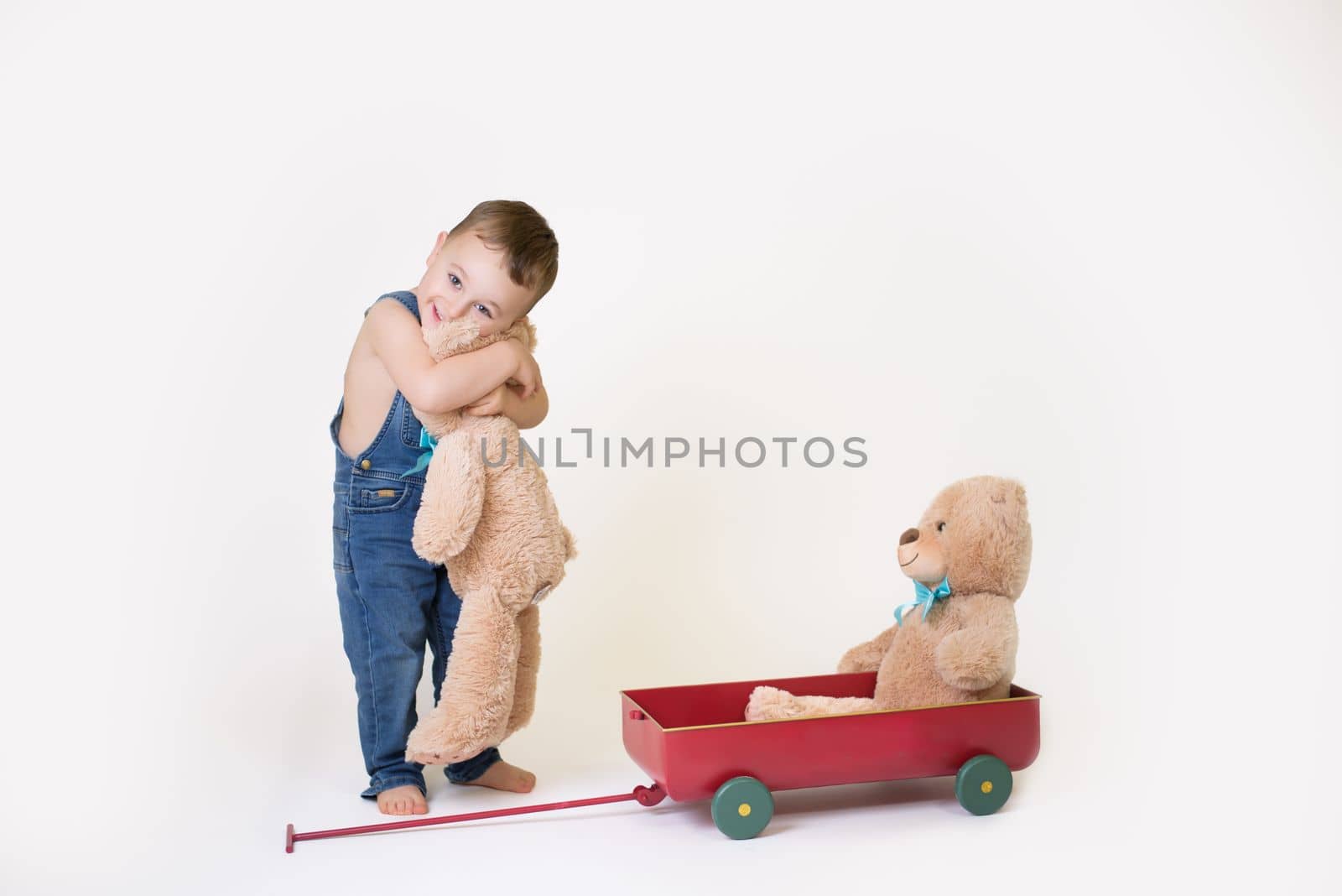 child playing with toys on white background.