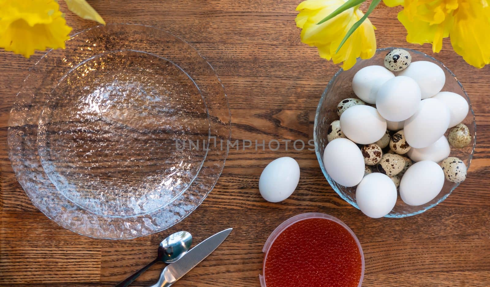 The recipe for making seggs stuffed with red caviar, cooking. Eggs, red caviar, top view, flat lay. Background of festive food products. preparing for Easter, waiting for the holiday