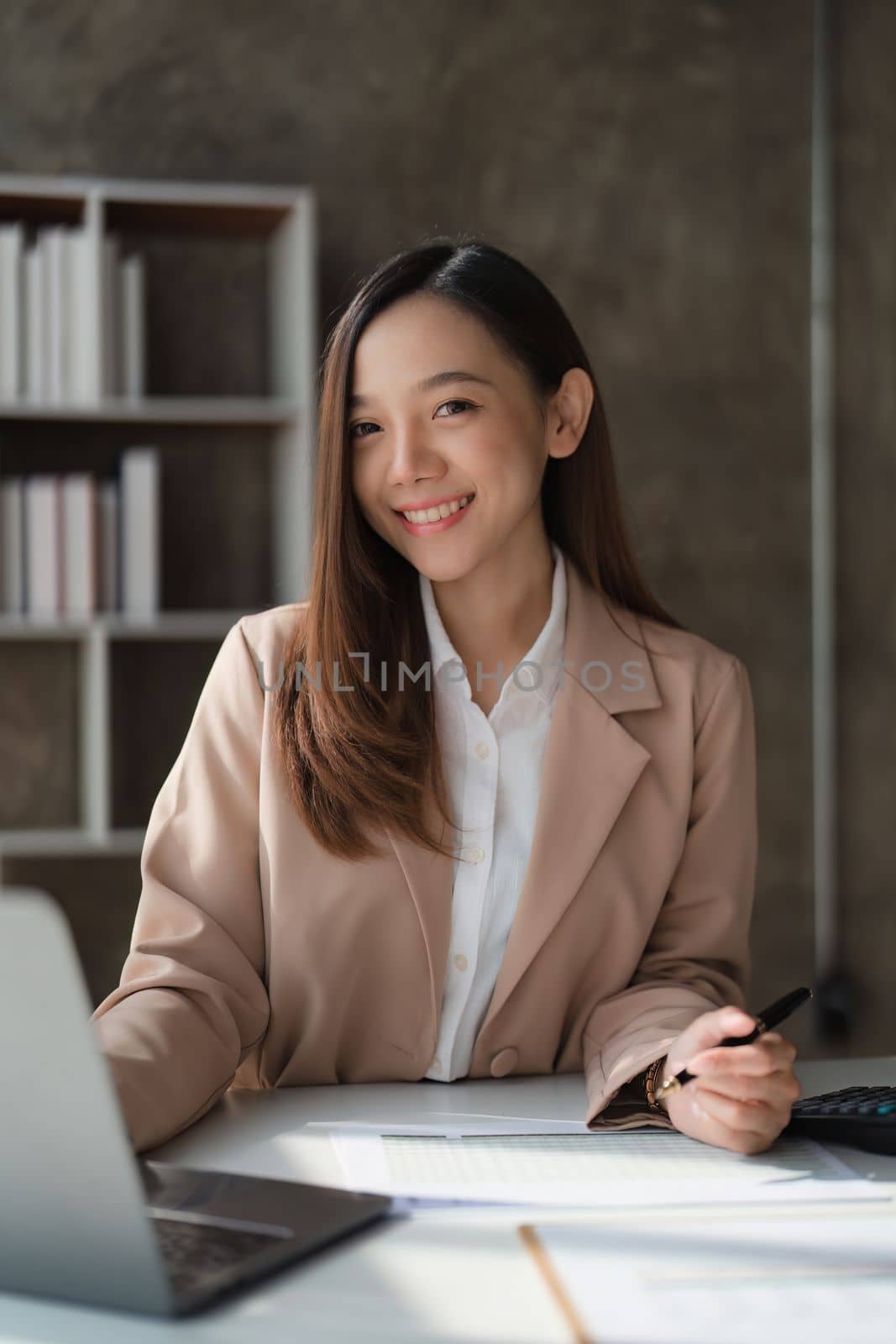 Asian Business woman working at home office and analyze financial report document. Accounting and Finance concept.