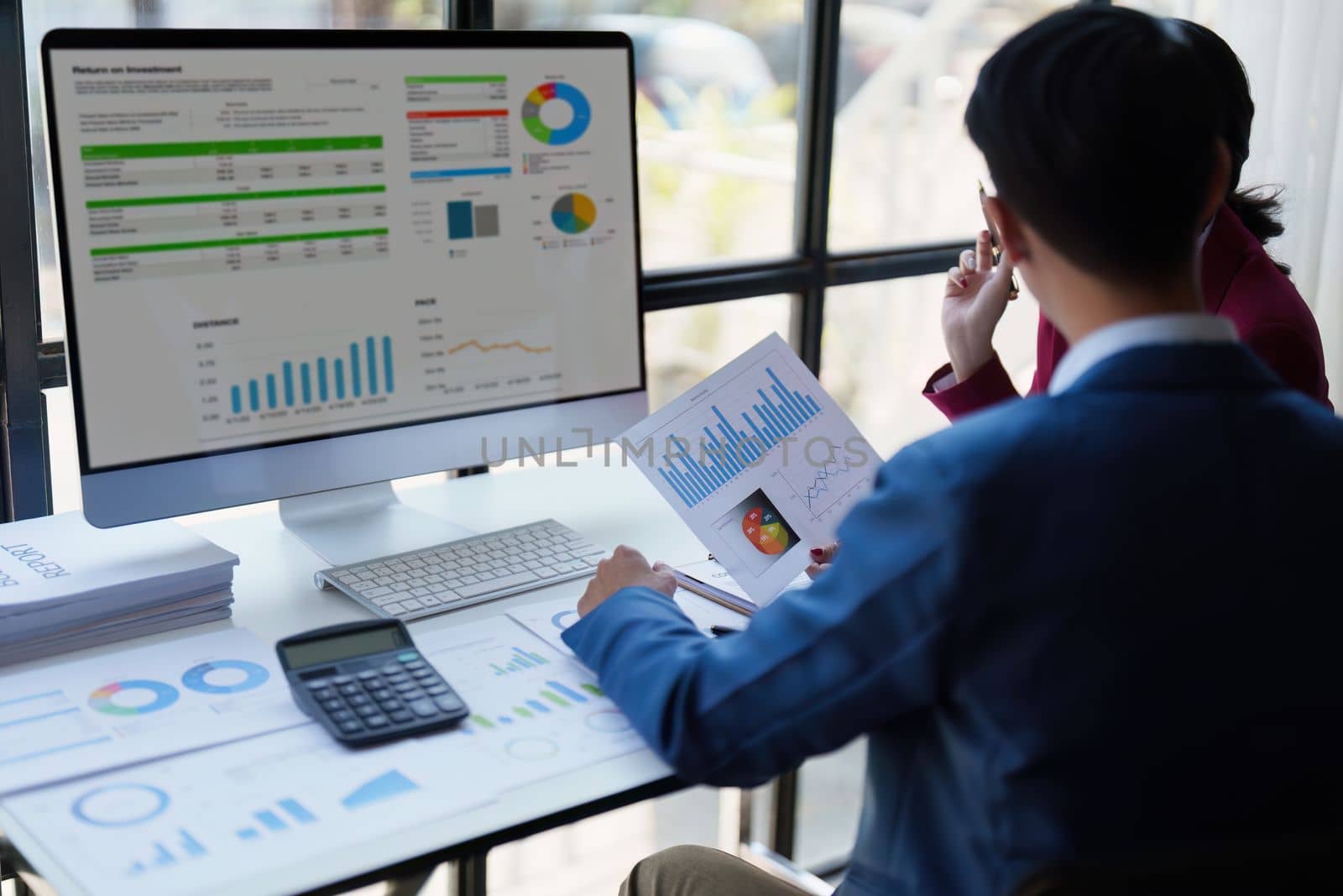 Beautiful business woman consultant talking with asian business person at meeting room with new financial market. Accounting concept.