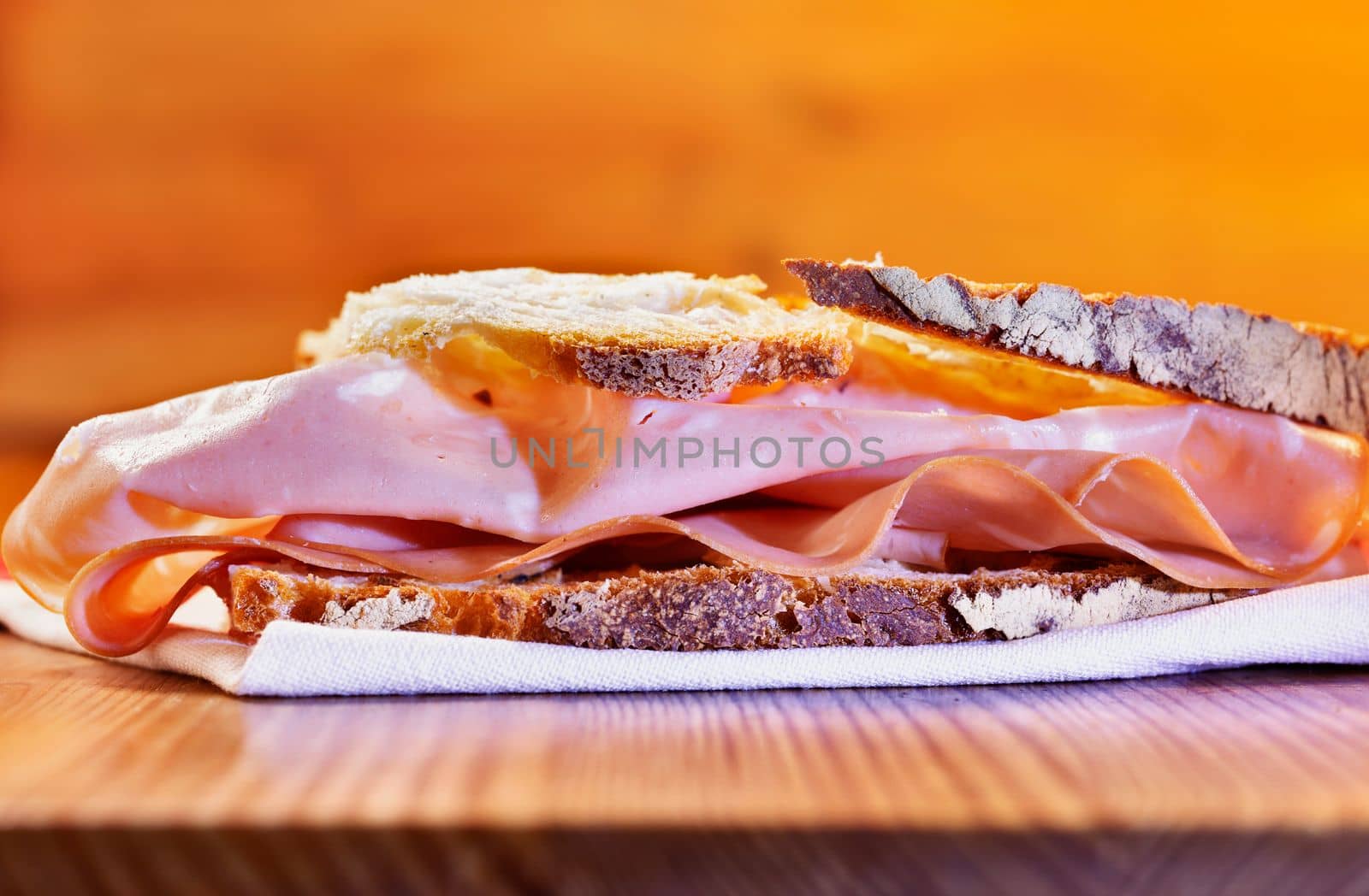  Appetizing mortadella sandwich on napkin , ready to eat , 