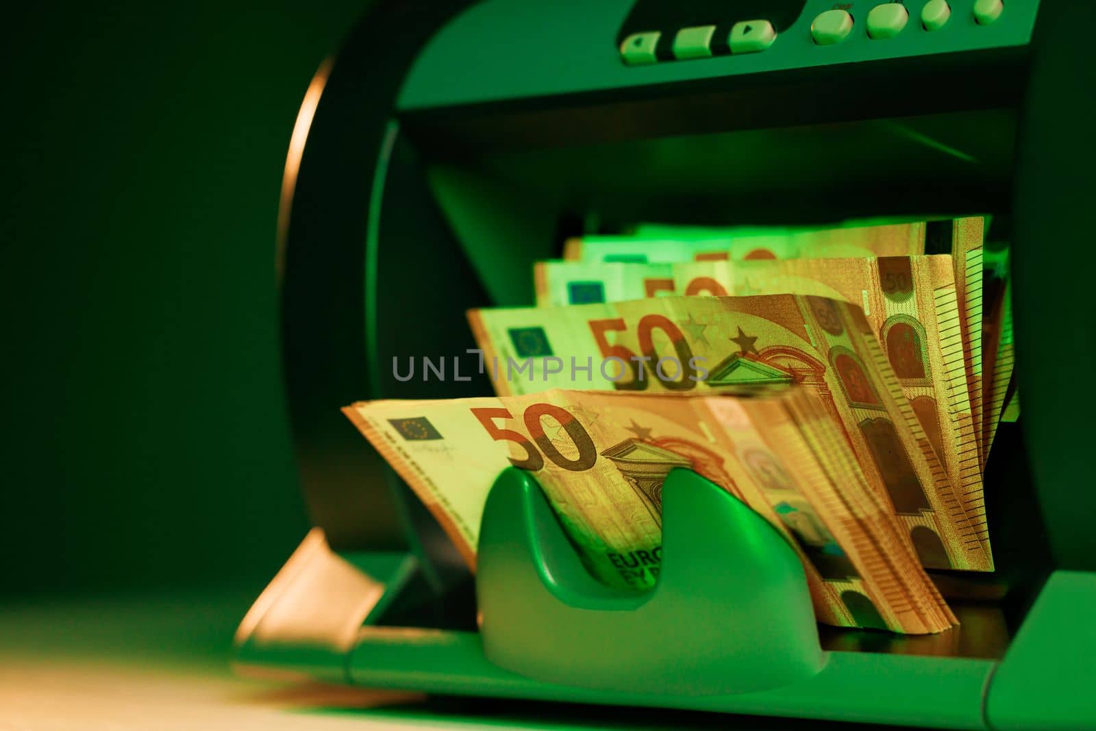 Financial banking currency calculating. Euro counting machine concept. Automatic money counting in the machine by uflypro