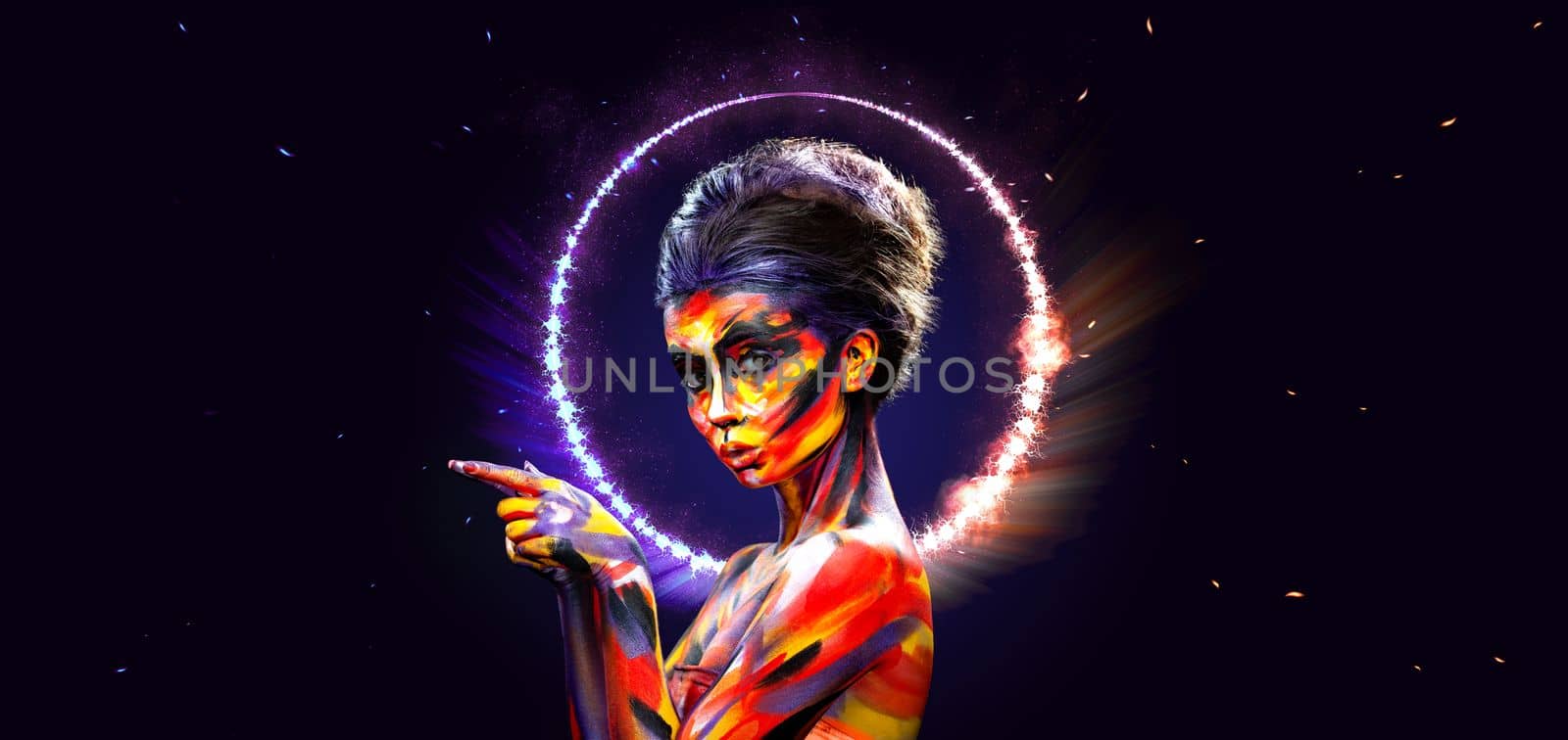 Girl in a glowing neon circle. Woman in color body painting on face. Design for a nightclub or mall poster. Download a photo for a mockup with discounts, promotions, announcements by MikeOrlov