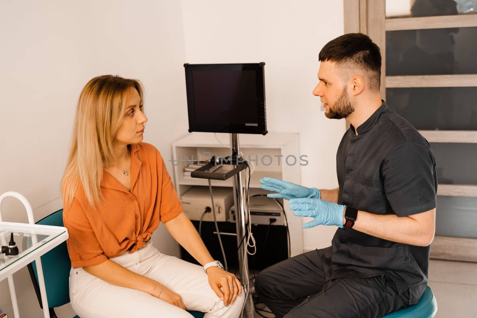 Woman visit ENT doctor. Consultation about endoscopy of nose for woman with otolaryngologist in a medical clinic