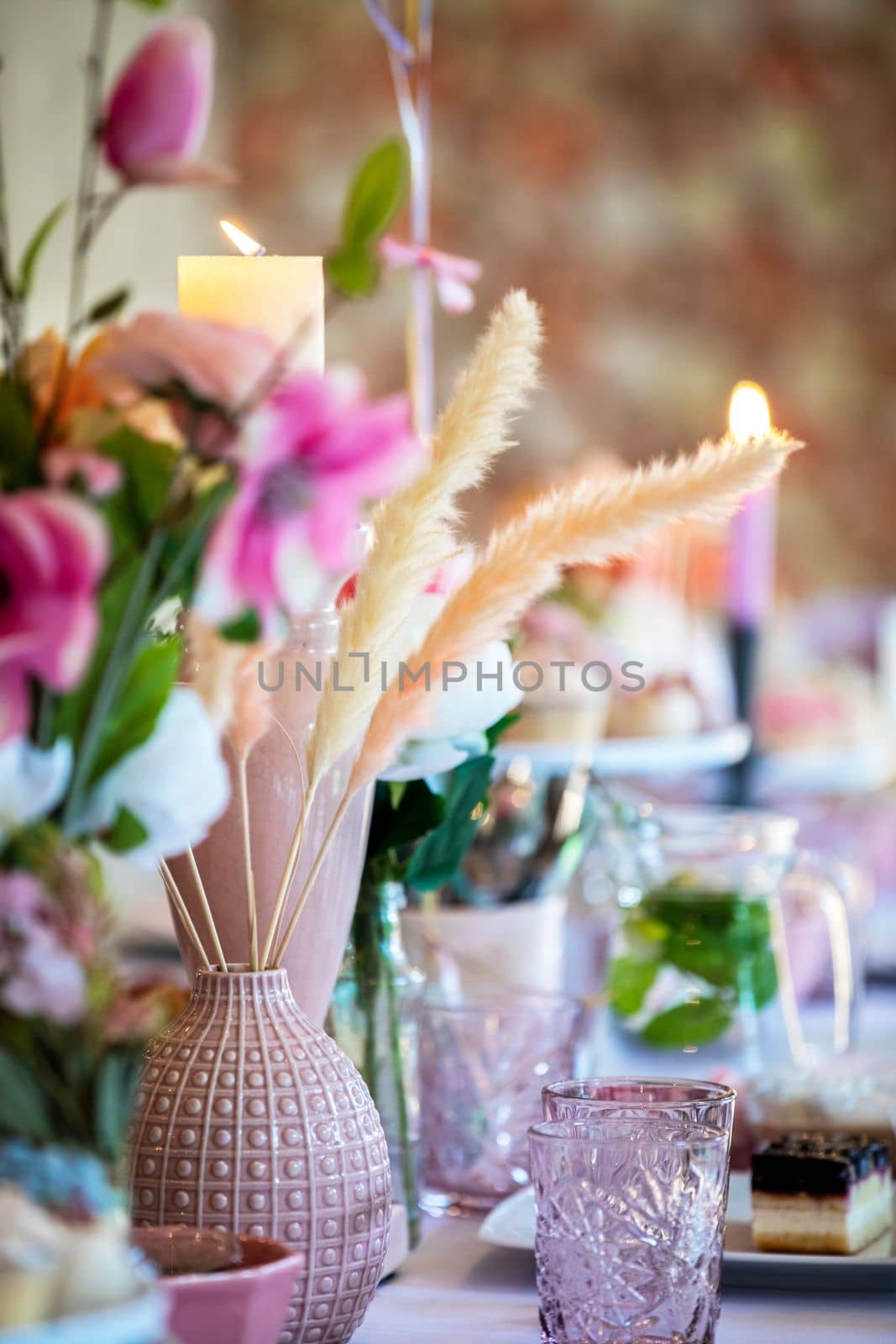 Table setting at a luxury wedding or party, babyshower, birthday and Beautiful flowers, cake,candles decortation on the table. High tea
