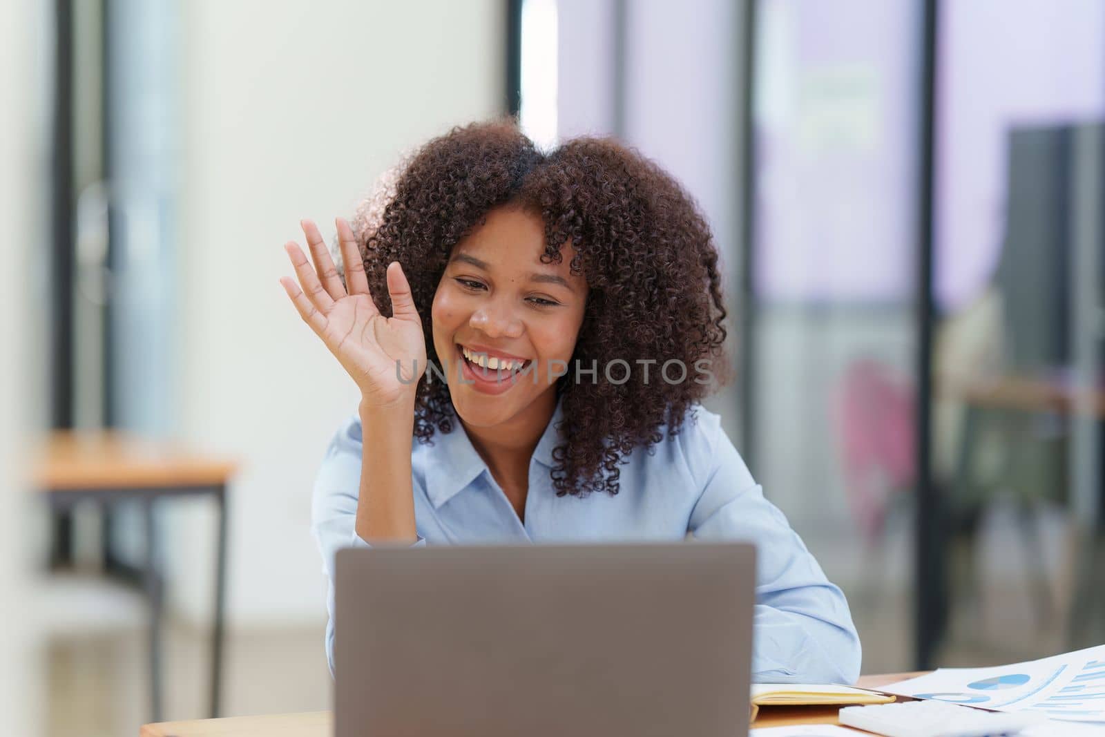Attractive black businesswoman using laptop video conference call, business colleagues. Communicating with team by itchaznong