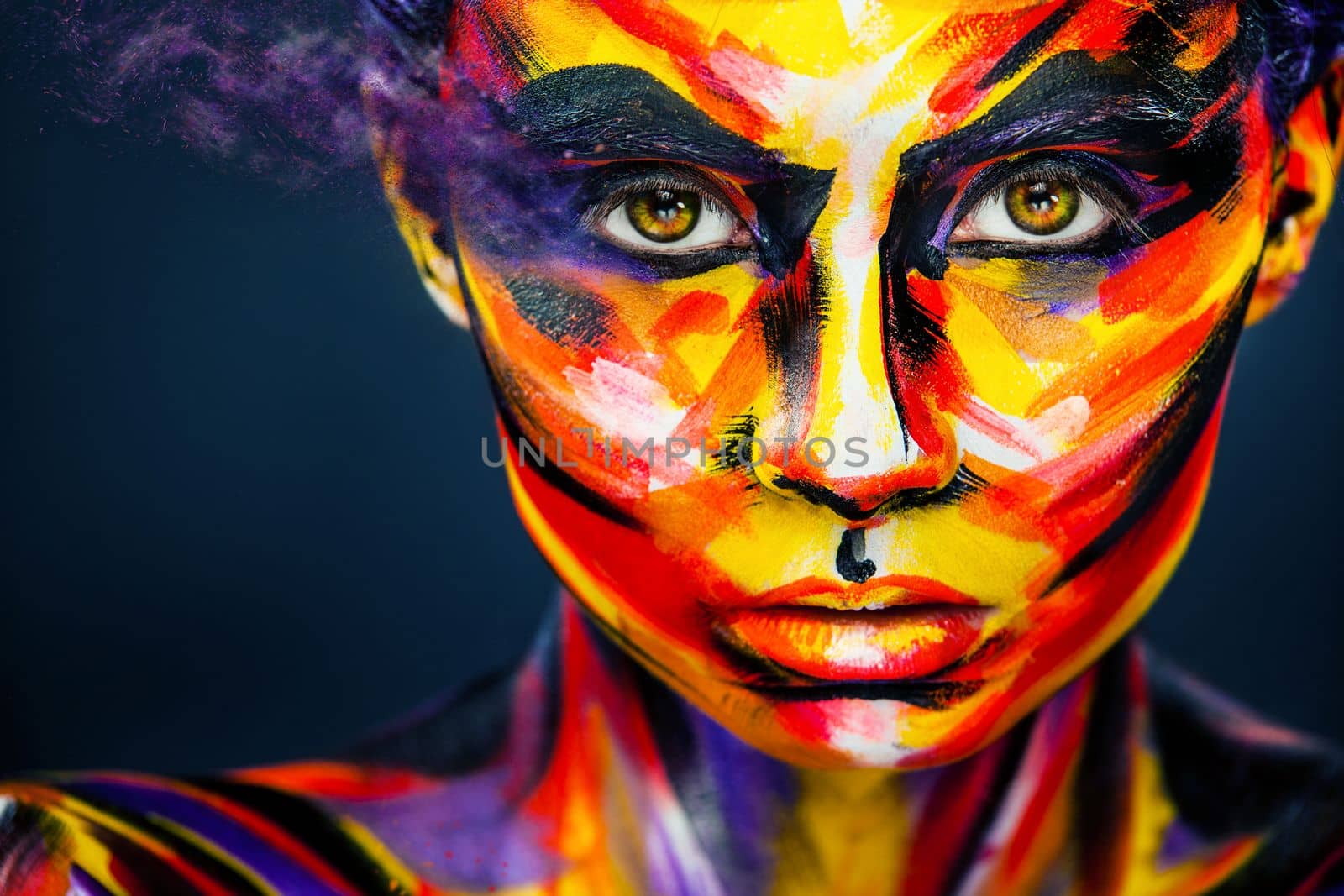 Portrait of the bright beautiful young woman with art make-up on dark background