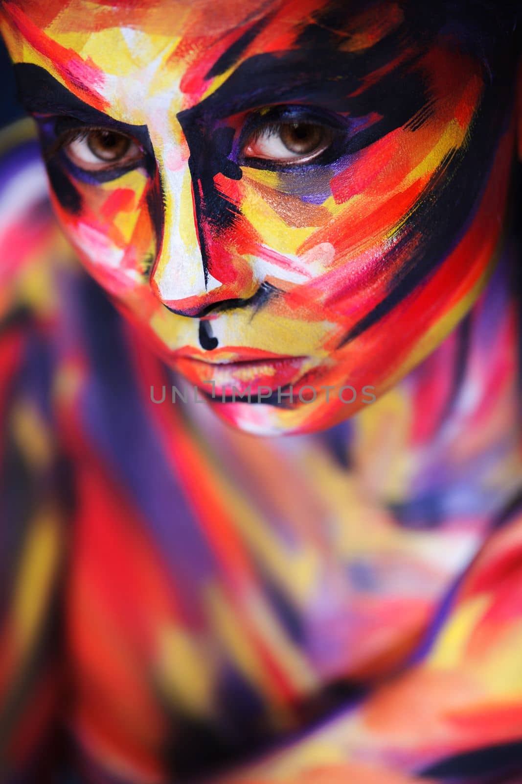 Portrait of the bright beautiful girl with painting art colorful make-up on face and bodyart. Creative vertical ads banner or flyer with copy space. by MikeOrlov