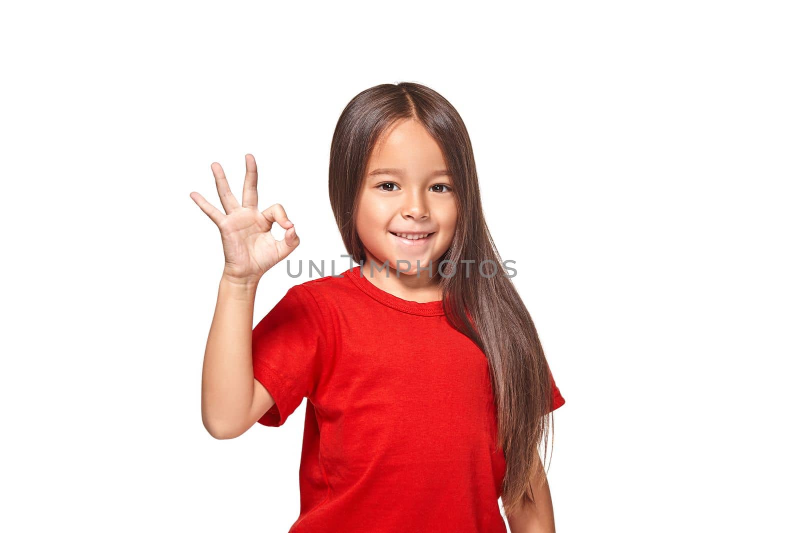 Girl showing positive sign on natural background by nazarovsergey