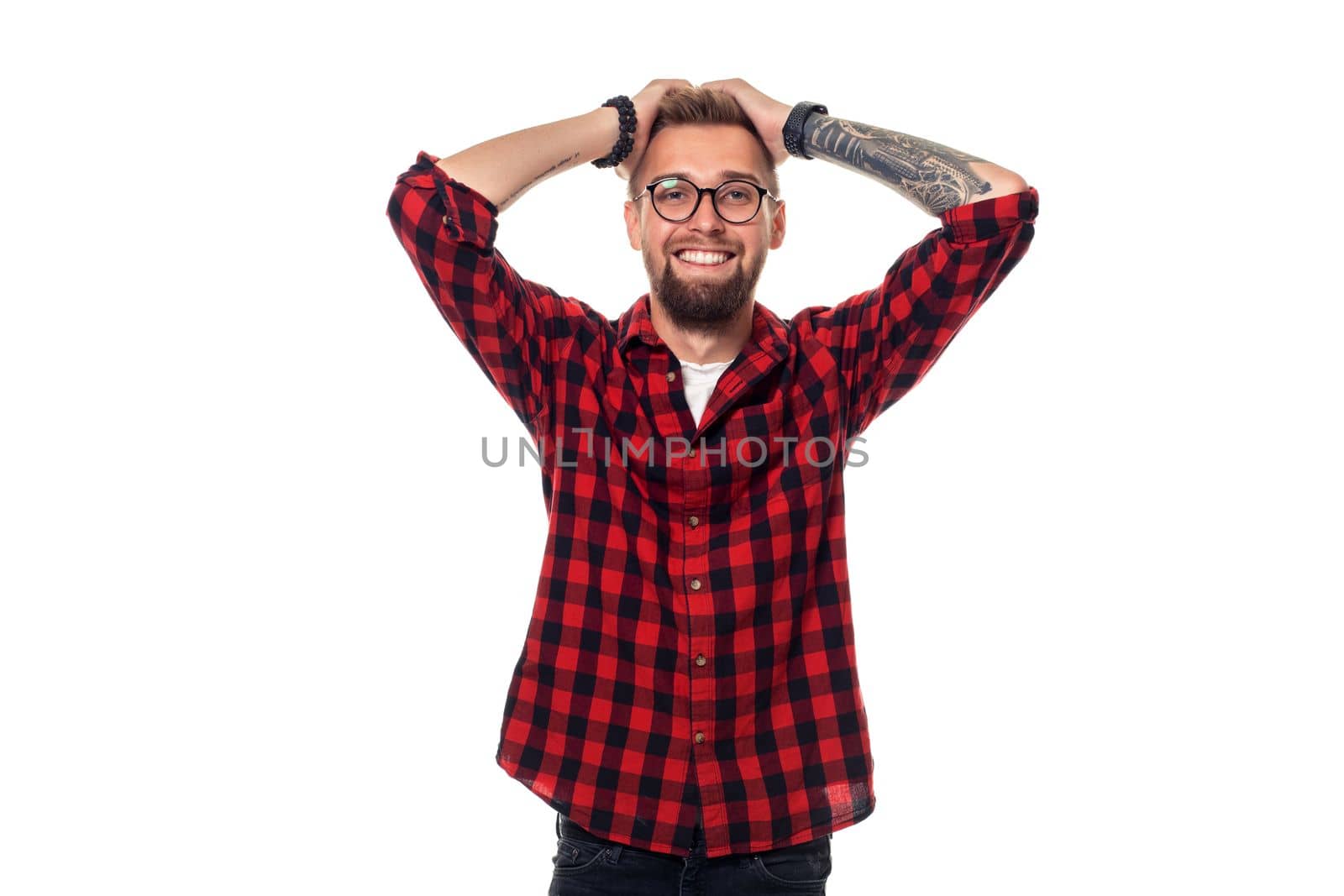Handsome man model studio portrait. Boy casual style, trendy hipster in checkered shirt look with cool hairstyle by nazarovsergey