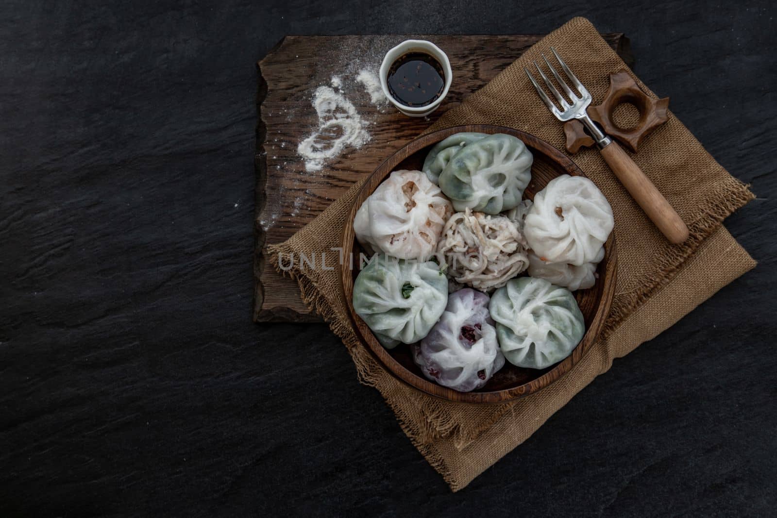Chinese chives Dumplings Mixed Color or Garlic Chives Dim Sum Rice Cake inside with Taro Slice ,Bamboo shoot and Many kind of vegetable inside the flour, Steamed Served Sweet Black Soy Sauce Chinese Food Style side view, Chinese Food Appetizer dish Style, Top view.