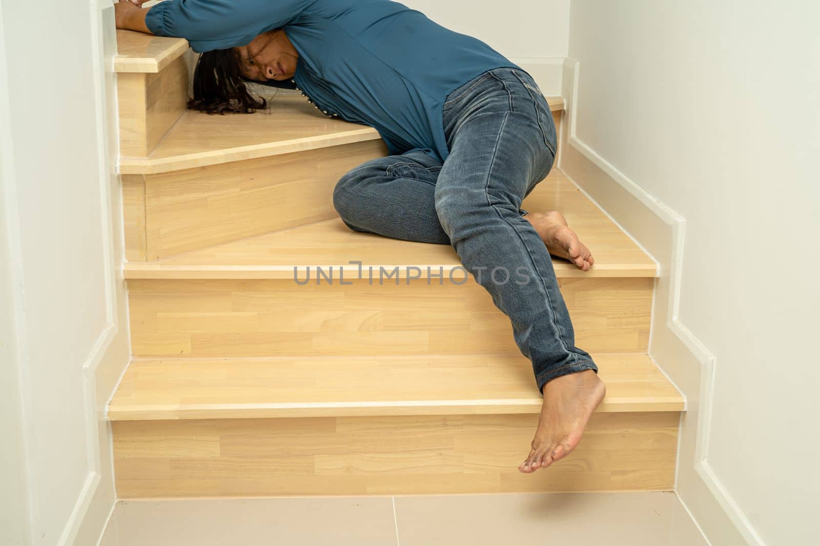 Asian lady woman patient fall down the stairs because slippery surfaces