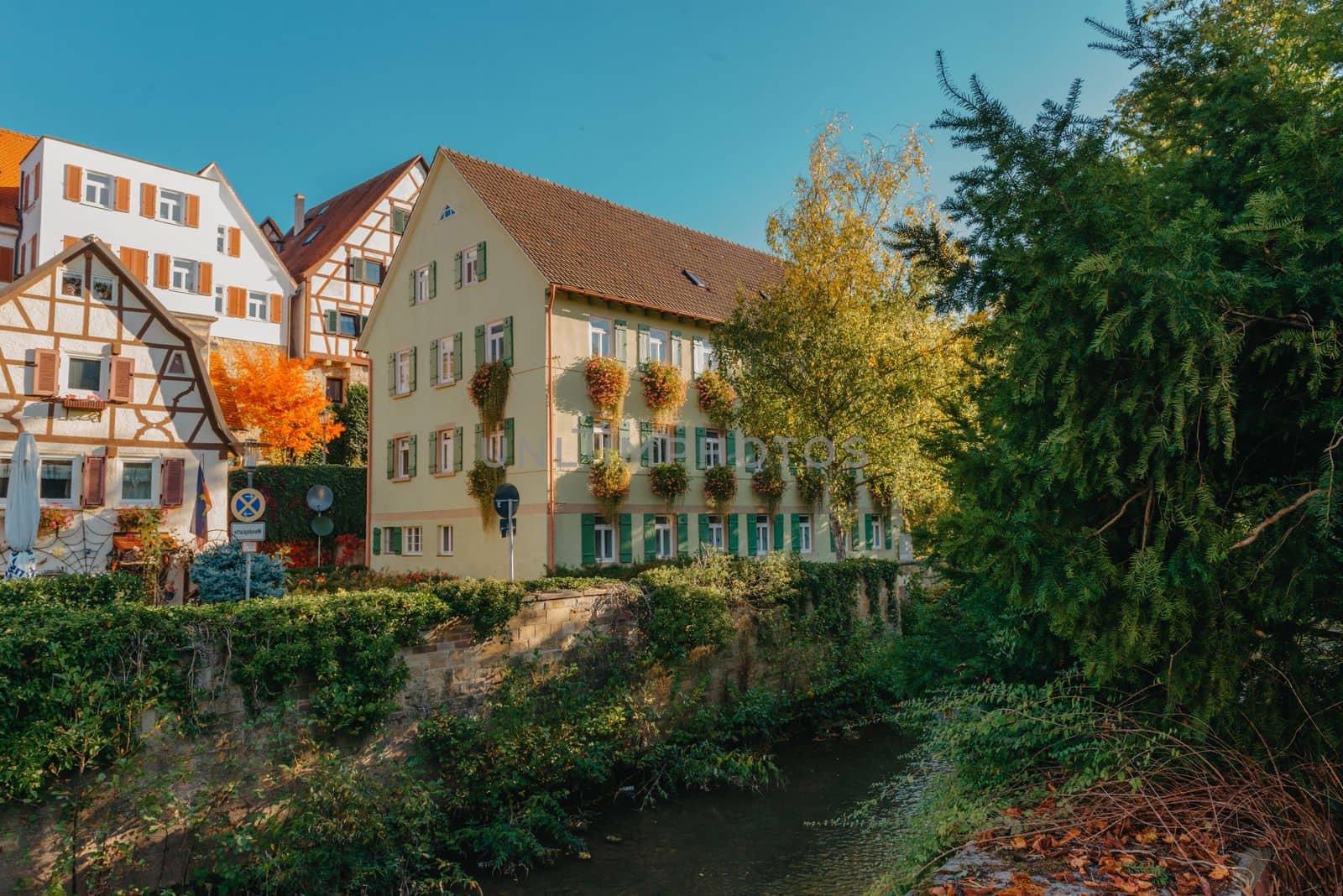 Old national German town house. Old Town is full of colorful and well preserved buildings. Baden-Wurttemberg is a state in southwest Germany bordering France and Switzerland. The Black Forest, known for its evergreen scenery and traditional villages, lies in the mountainous southwest. Stuttgart, the capital, is home to Wilhelma, a royal estate turned zoo and gardens. Porsche and Mercedes-Benz have headquarters and museums there. The 19th-century Hohenzollern Castle sits in the Swabian Alps to the south.