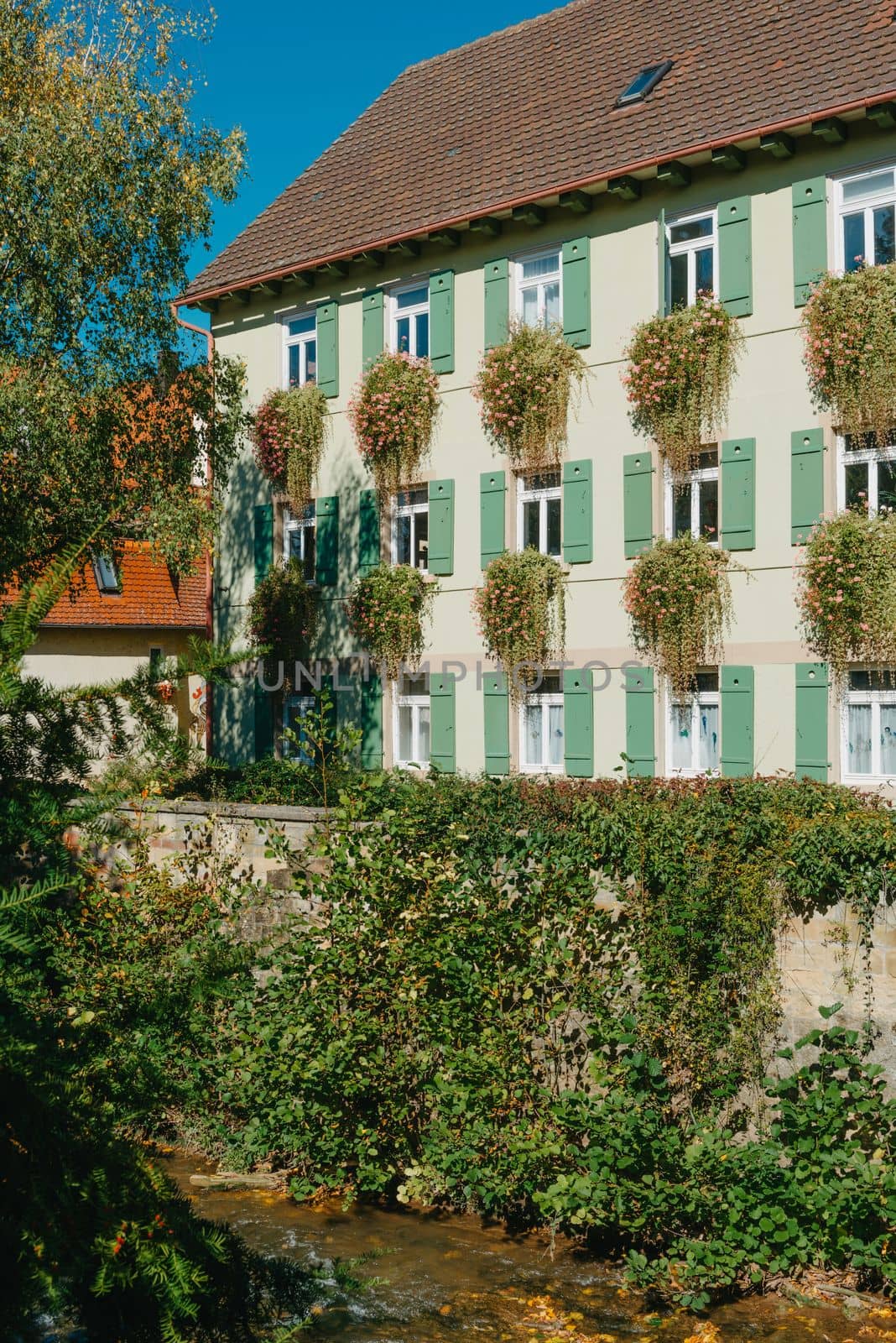 Old national German town house. Old Town is full of colorful and well preserved buildings. Baden-Wurttemberg is a state in southwest Germany bordering France and Switzerland. The Black Forest, known for its evergreen scenery and traditional villages, lies in the mountainous southwest. Stuttgart, the capital, is home to Wilhelma, a royal estate turned zoo and gardens. Porsche and Mercedes-Benz have headquarters and museums there. The 19th-century Hohenzollern Castle sits in the Swabian Alps to the south.