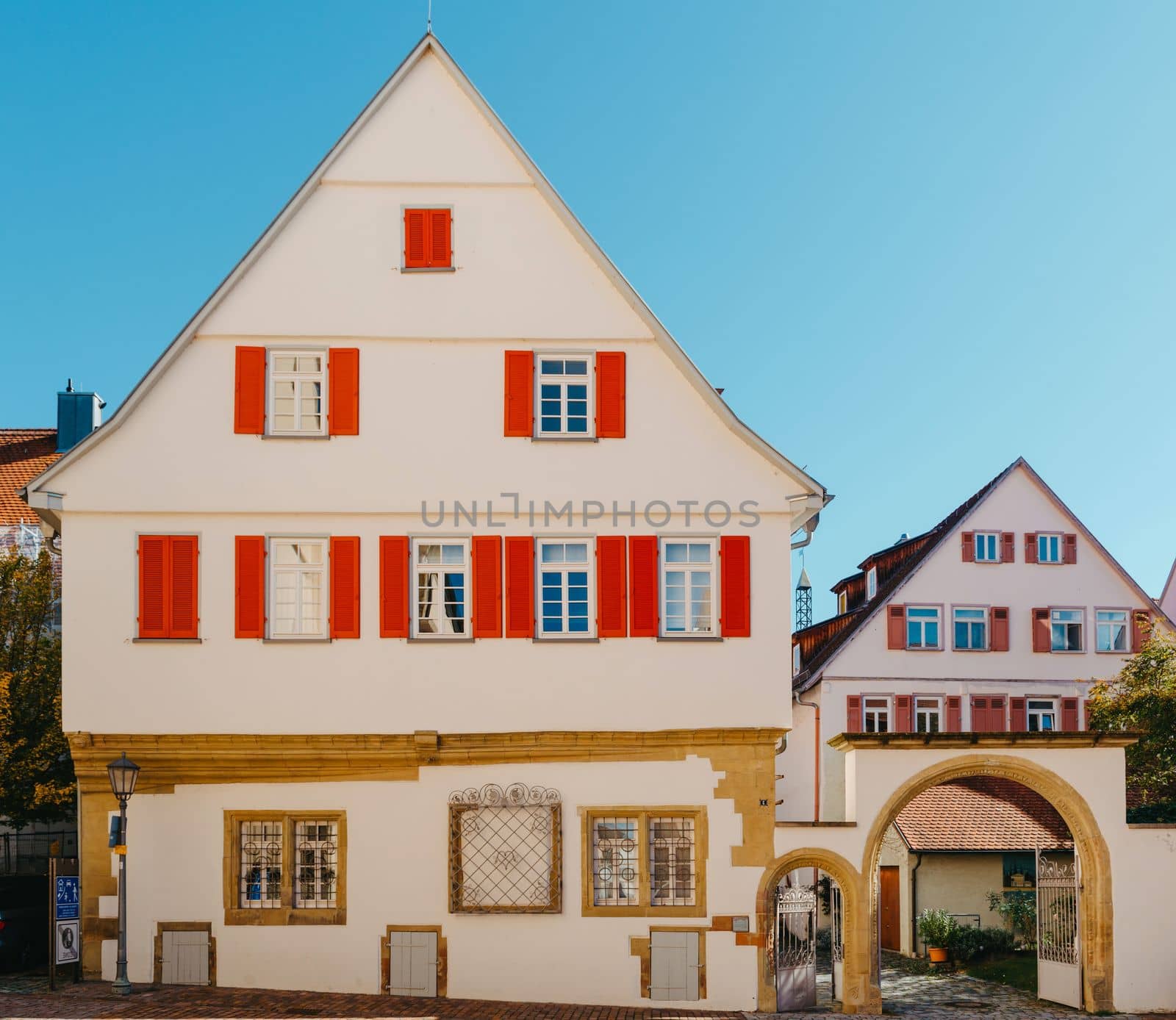 Old national German town house. Old Town is full of colorful and well preserved buildings. Baden-Wurttemberg is a state in southwest Germany bordering France and Switzerland. The Black Forest, known for its evergreen scenery and traditional villages, lies in the mountainous southwest. Stuttgart, the capital, is home to Wilhelma, a royal estate turned zoo and gardens. Porsche and Mercedes-Benz have headquarters and museums there. The 19th-century Hohenzollern Castle sits in the Swabian Alps to the south.