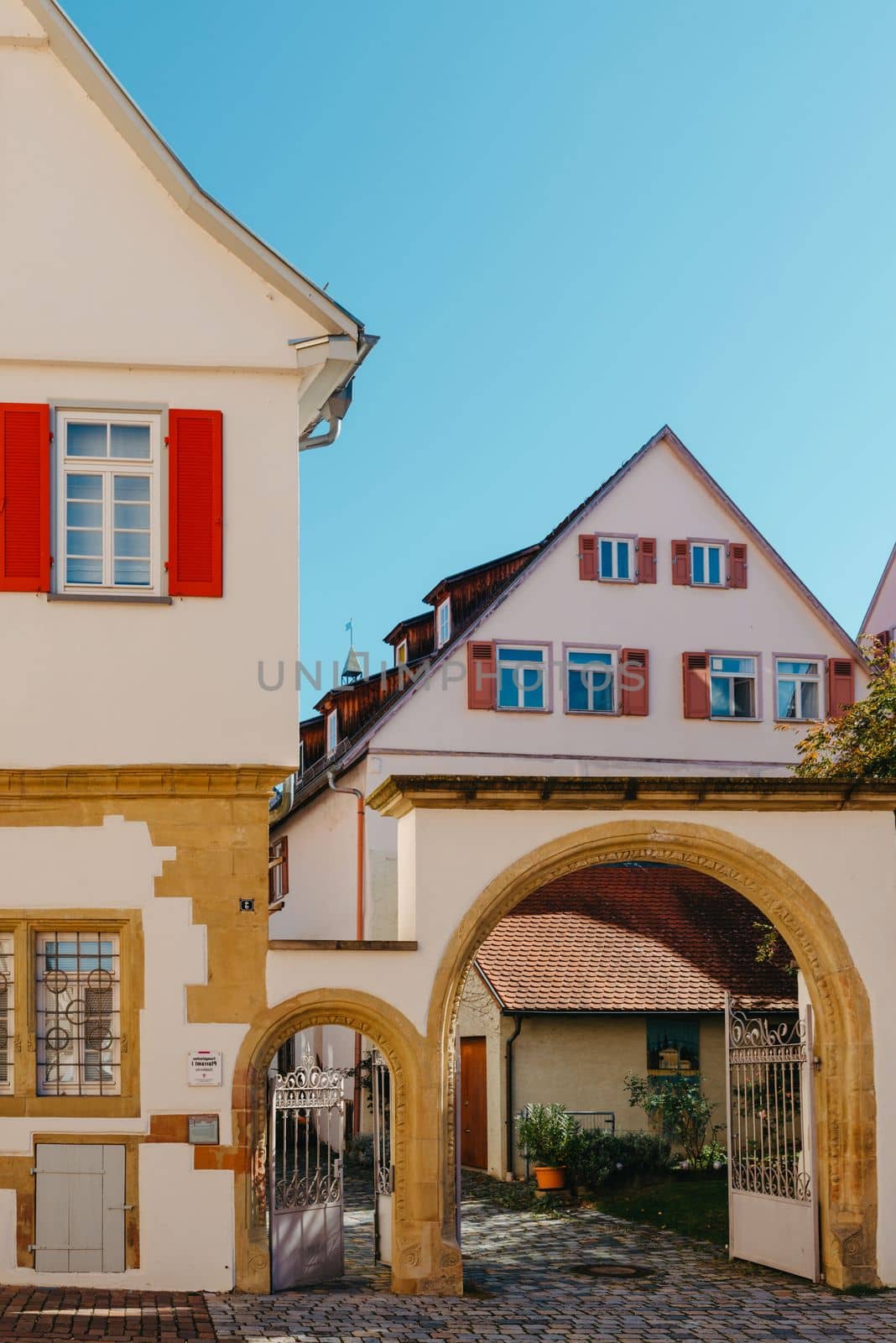 Old national German town house. Old Town is full of colorful and well preserved buildings. Baden-Wurttemberg is a state in southwest Germany bordering France and Switzerland. The Black Forest, known for its evergreen scenery and traditional villages, lies in the mountainous southwest. Stuttgart, the capital, is home to Wilhelma, a royal estate turned zoo and gardens. Porsche and Mercedes-Benz have headquarters and museums there. The 19th-century Hohenzollern Castle sits in the Swabian Alps to the south.