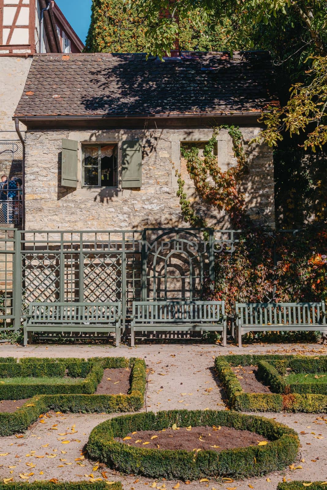 House with nice garden in fall. Flowers in the Park. Bietigheim-Bissingen. Germany, Europe. Autumn Park and house, nobody, bush and grenery