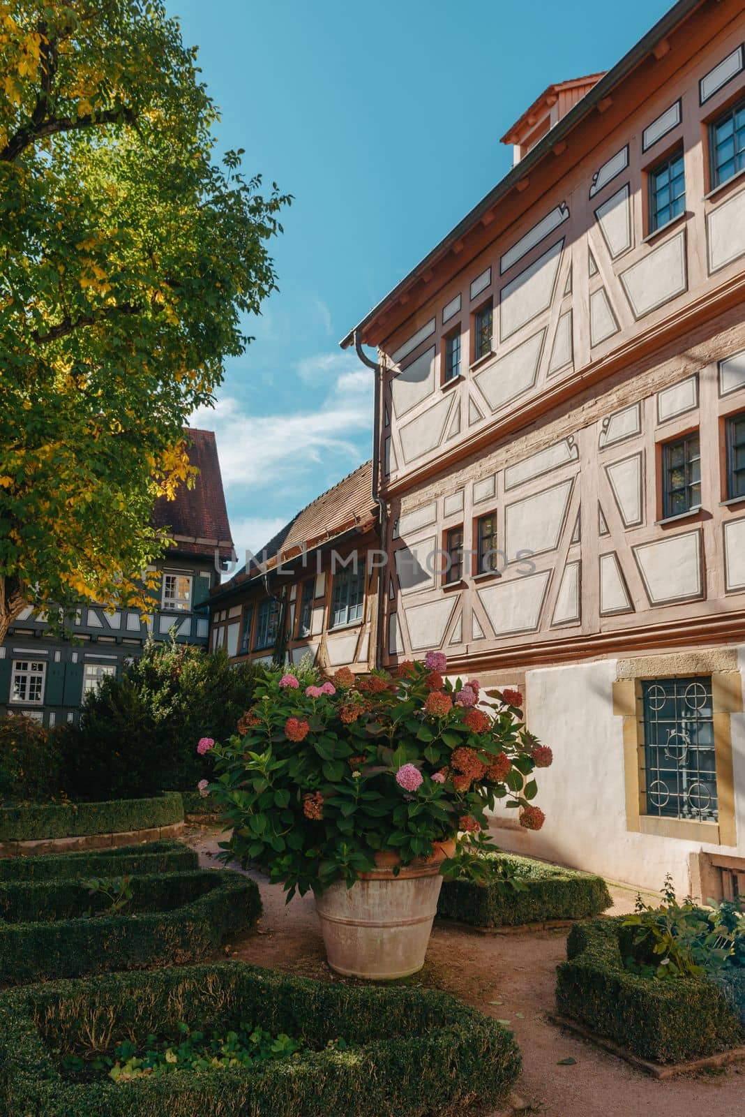 Old national German town house. Old Town is full of colorful and well preserved buildings. Baden-Wurttemberg is a state in southwest Germany bordering France and Switzerland. The Black Forest, known for its evergreen scenery and traditional villages, lies in the mountainous southwest. Stuttgart, the capital, is home to Wilhelma, a royal estate turned zoo and gardens. Porsche and Mercedes-Benz have headquarters and museums there. The 19th-century Hohenzollern Castle sits in the Swabian Alps to the south.