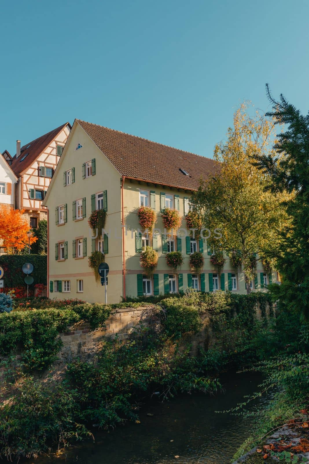 Old national German town house. Old Town is full of colorful and well preserved buildings. Baden-Wurttemberg is a state in southwest Germany bordering France and Switzerland. The Black Forest, known for its evergreen scenery and traditional villages, lies in the mountainous southwest. Stuttgart, the capital, is home to Wilhelma, a royal estate turned zoo and gardens. Porsche and Mercedes-Benz have headquarters and museums there. The 19th-century Hohenzollern Castle sits in the Swabian Alps to the south.