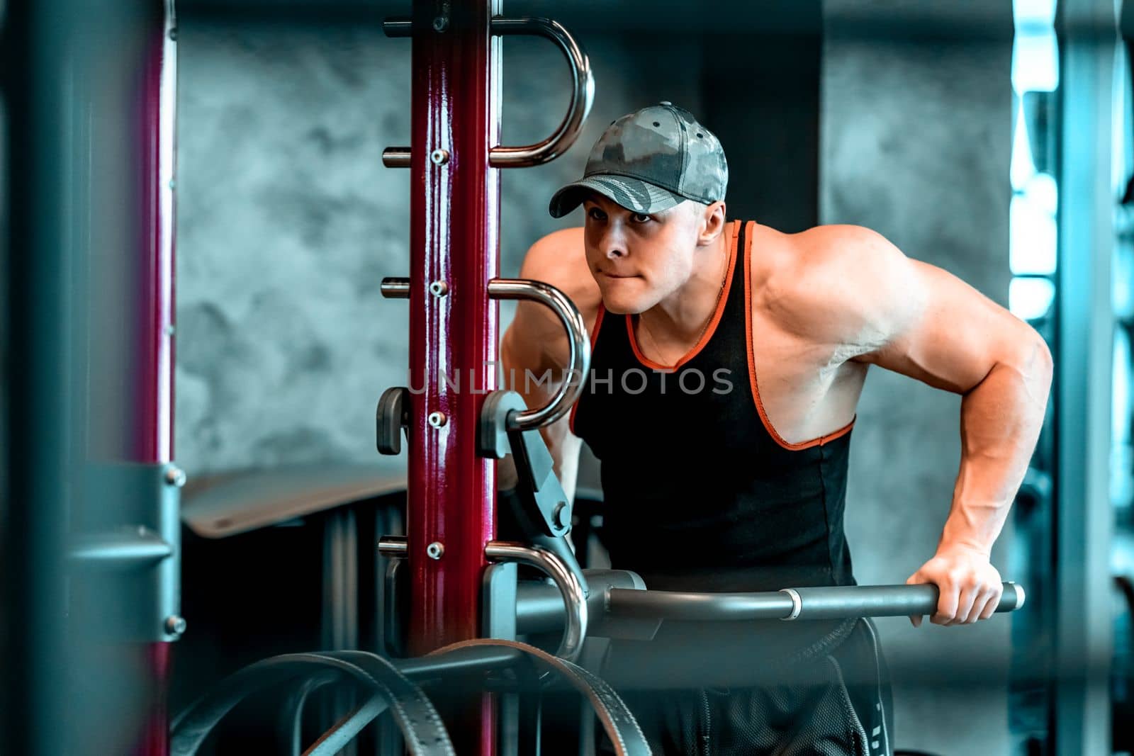 athlete on parallel bars in the gym. High quality photo