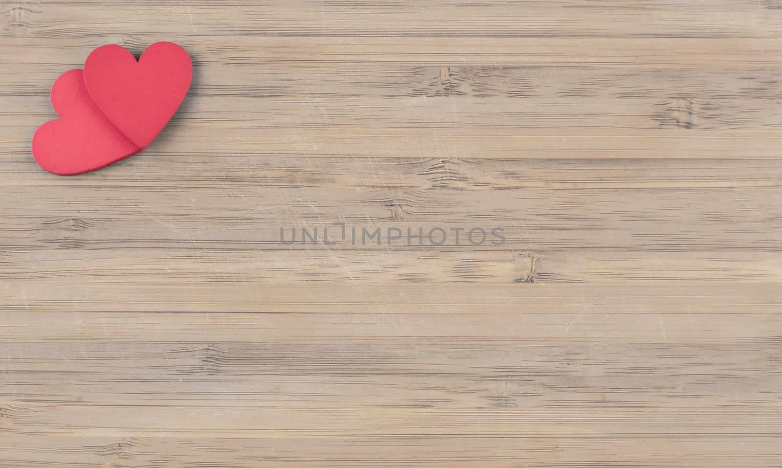 red wooden hearts on wooden background by Kondrateva