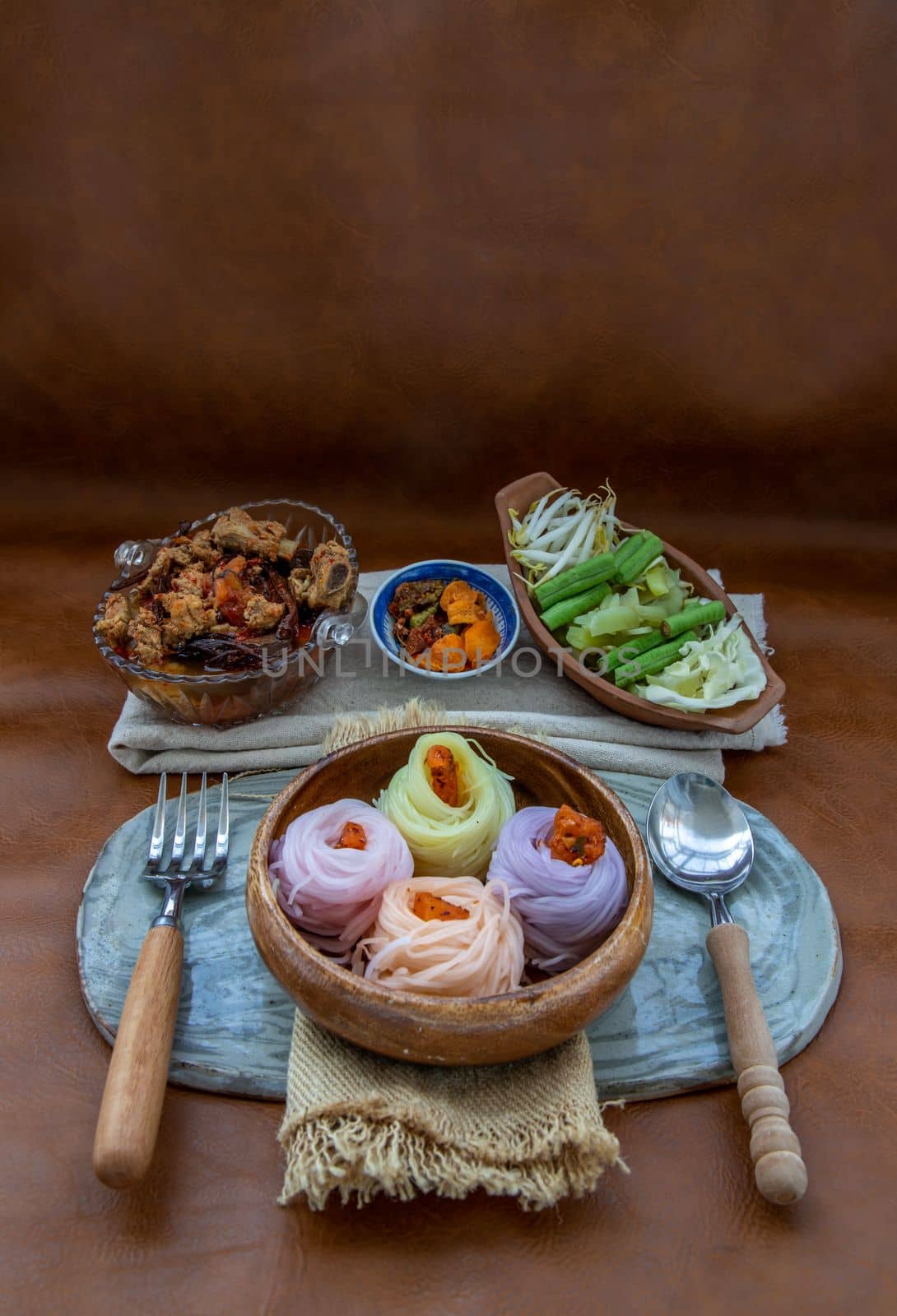 Rice noodles with spicy pork sauce or Nam ngiao Rice Noodle (Traditional Northern Thai Cuisine). Nam ngiao has a characteristic spicy and tangy flavor Served with vegetable. Thai spicy food.