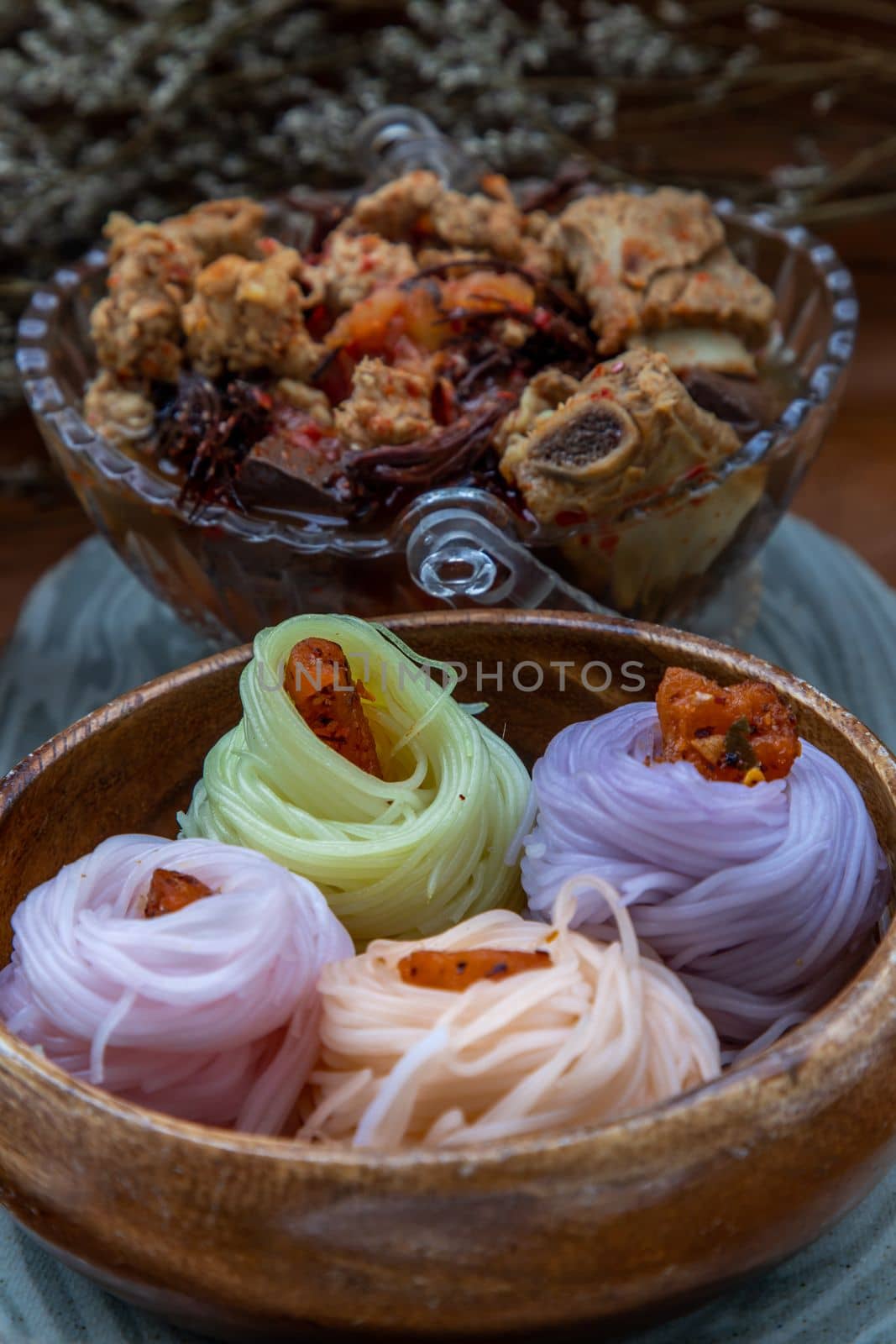 Rice noodles with spicy pork sauce or Nam ngiao Rice Noodle (Traditional Northern Thai Cuisine). Nam ngiao has a characteristic spicy and tangy flavor. Thai spicy food.