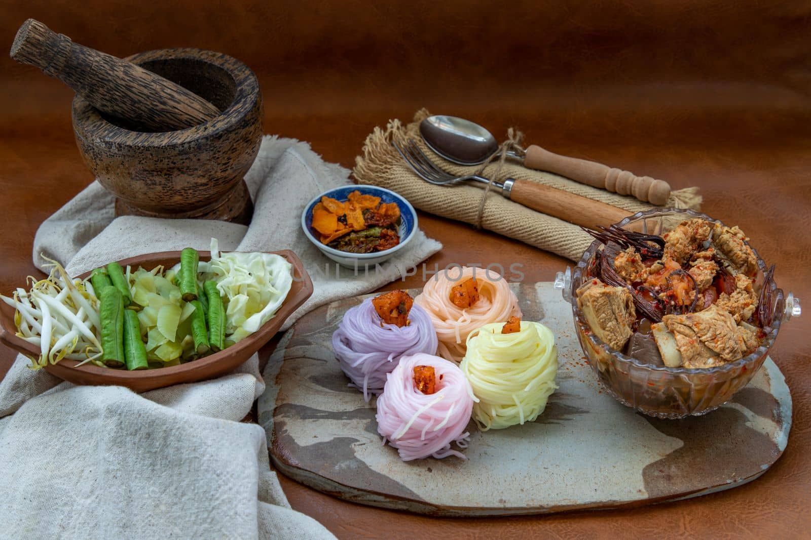Rice noodles with spicy pork sauce or Nam ngiao Rice Noodle (Traditional Northern Thai Cuisine). Nam ngiao has a characteristic spicy and tangy flavor Served with vegetable. Thai spicy food.