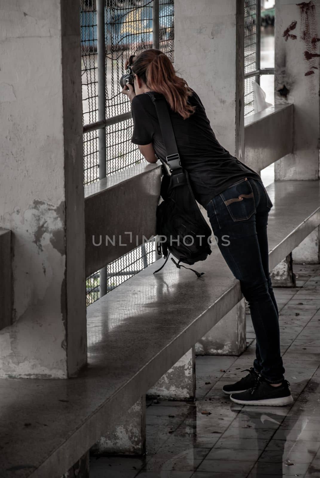 Bangkok, Thailand 27 Sep,2019 : Side view of photographer Young woman traveler taking photo River by camera, Relax holiday hobby concept.