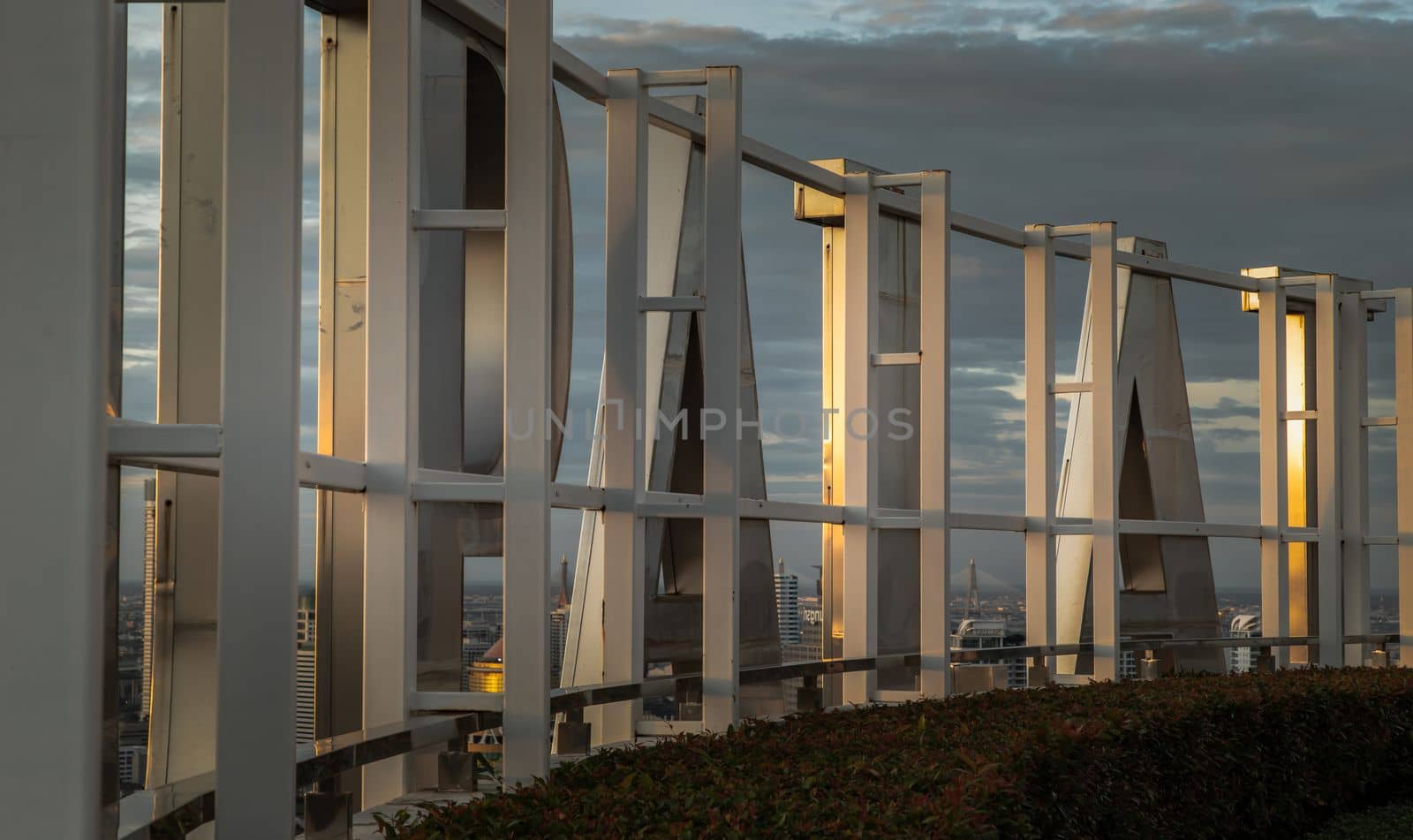 Bangkok, thailand - Jul 31, 2021 : Backside of Condominium sign above the modern Condominium complex in the downtown bangkok city area at evening time. No focus, specifically.