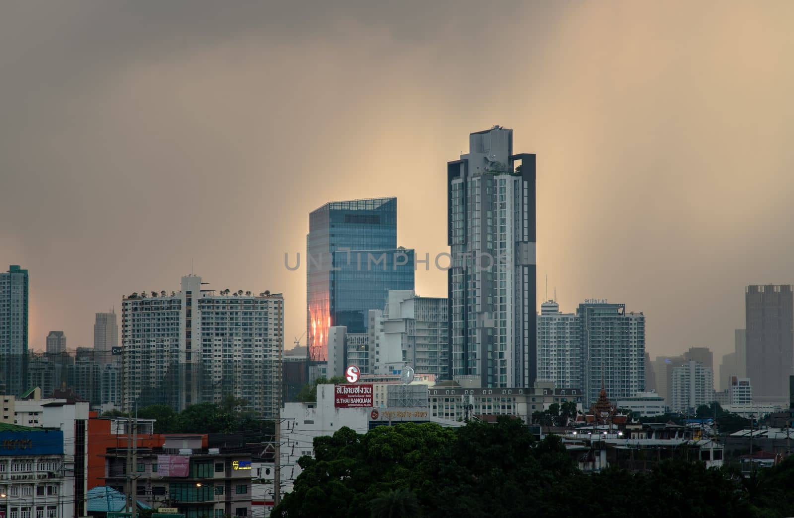 Bangkok, Thailand - May 09, 2021 : Aerial view of Beautiful scenery view of Skyscraper Evening time before Sunset creates relaxing feeling for the rest of the day. Selective focus.