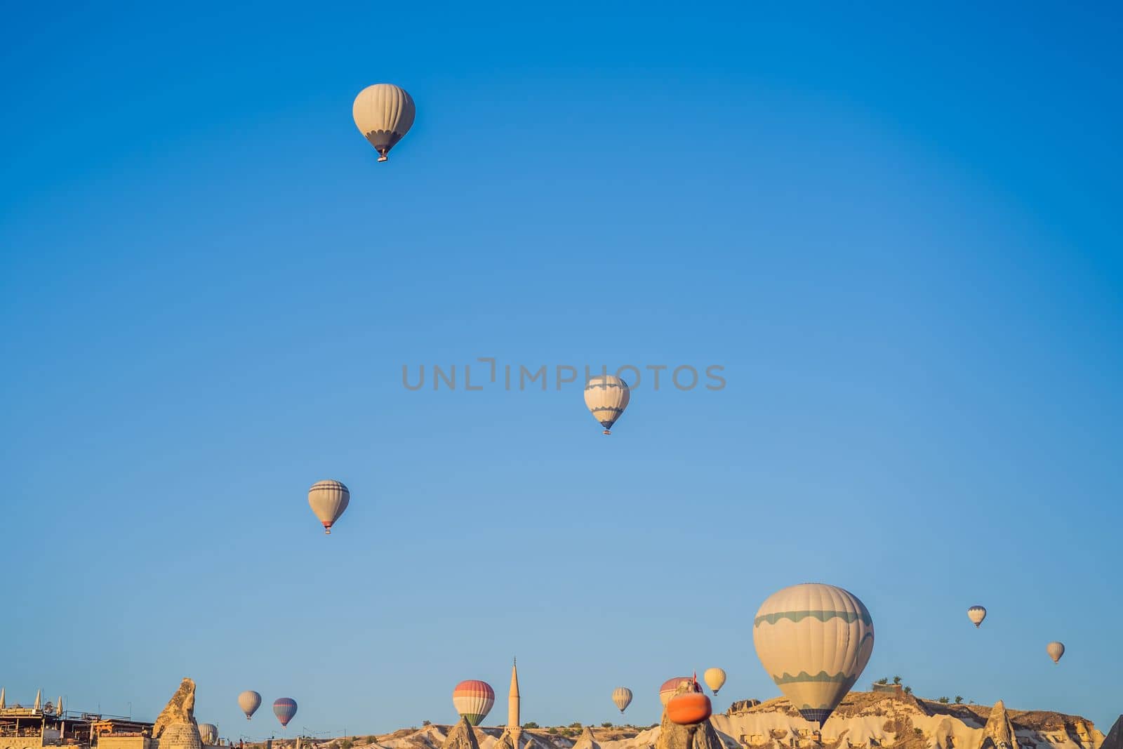 Colorful hot air balloon flying over Cappadocia, Turkey.