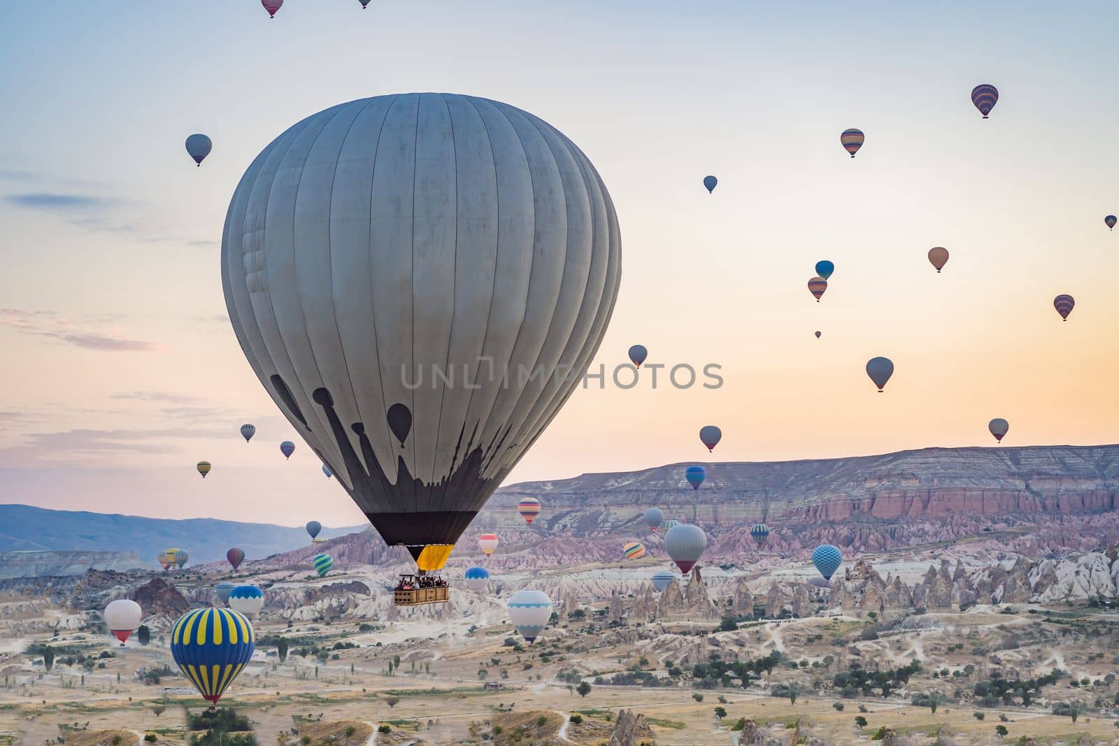 Colorful hot air balloon flying over Cappadocia, Turkey.