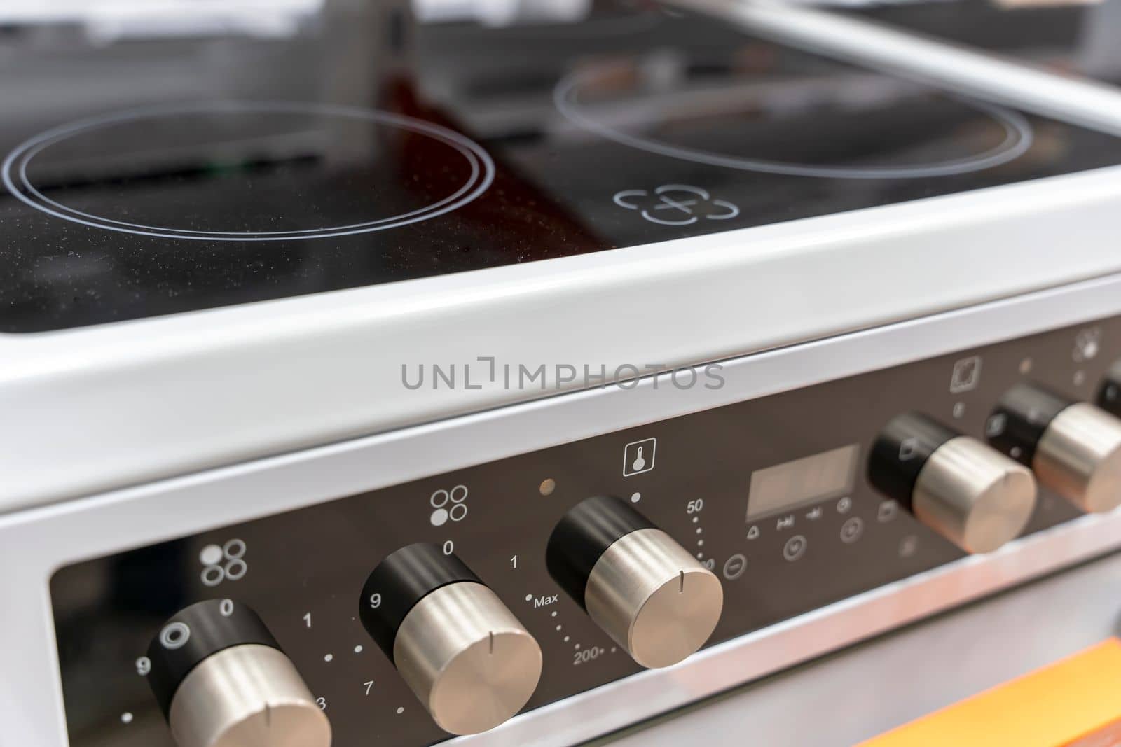 the handle for turning on the burner of a home kitchen stove. close-up. Home gas stove. The job in the kitchen. Control knobs of electric stove close-up