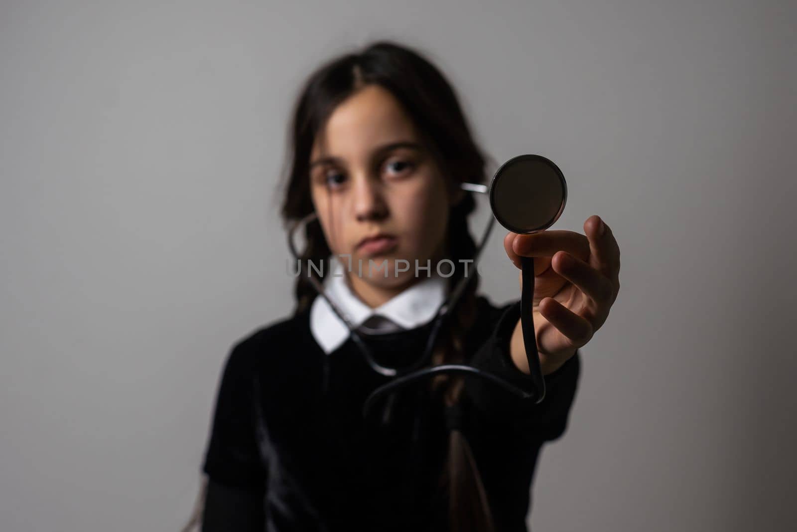 Wednesday student girl with a stethoscope.