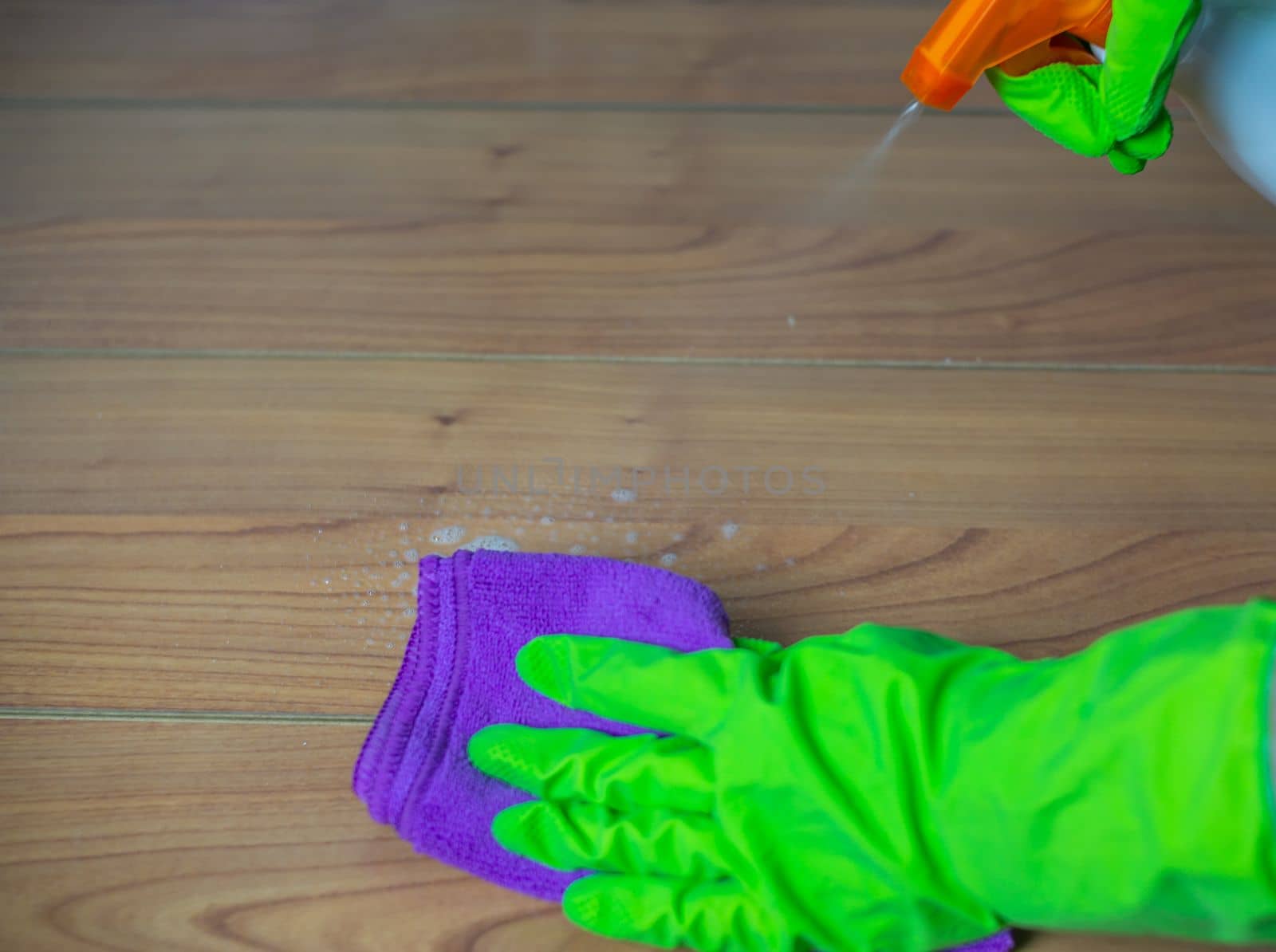 woman using cleaning products at home